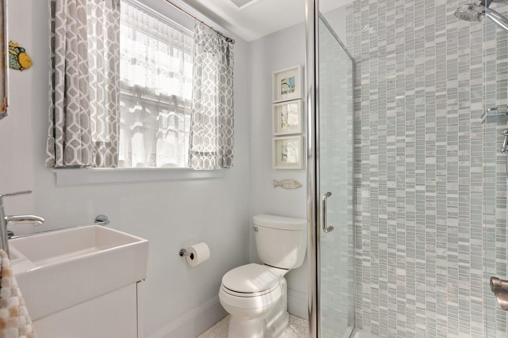 30 Homestead Road Marblehead, MA 01945 - Photo 22 of 35 a white toilet sitting next to a bathroom sink