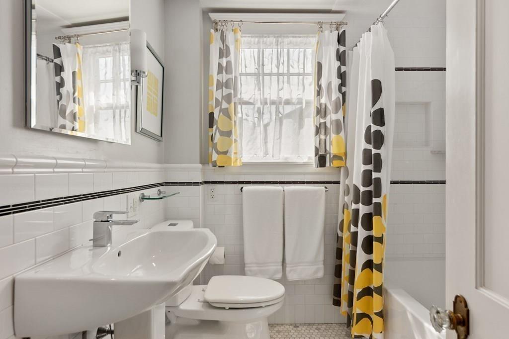 30 Homestead Road Marblehead, MA 01945 - Photo 27 of 35 a bathroom with a sink a toilet and a mirror