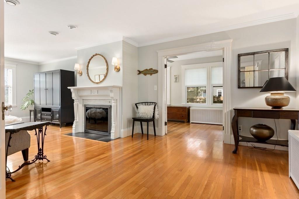 30 Homestead Road Marblehead, MA 01945 - Photo 8 of 35 a living room with furniture a fireplace and dining table