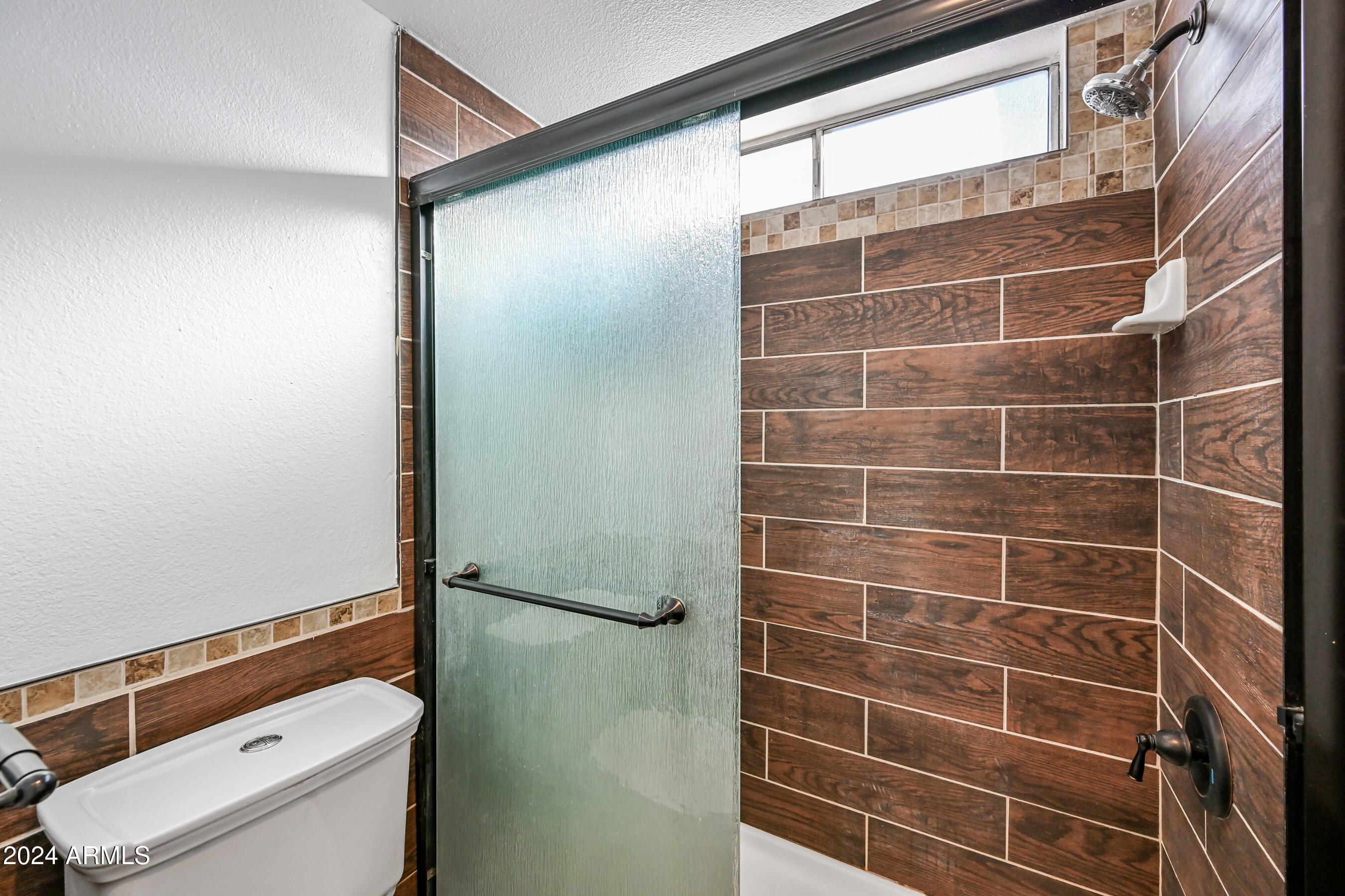 10610 South 48th Street, Unit 1081 Phoenix, AZ 85044 - Photo 17 of 17 a bathroom with a bathtub and a shower
