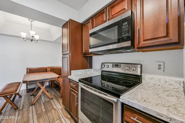 a kitchen with a stove and a microwave