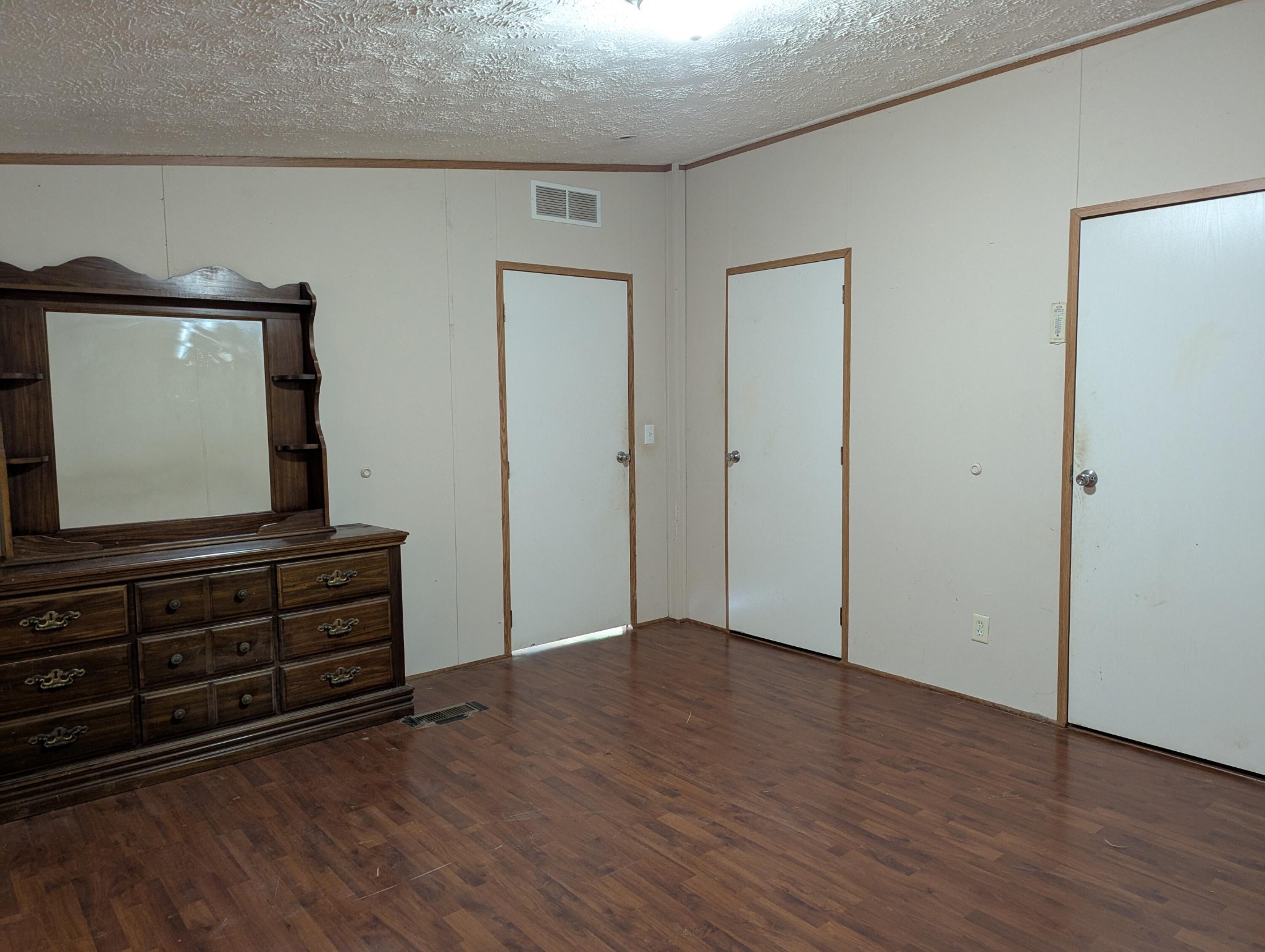 313 Burton Road Sweetwater, TN 37874 - Photo 12 of 38 a view of an empty room with wooden floor and cabinet