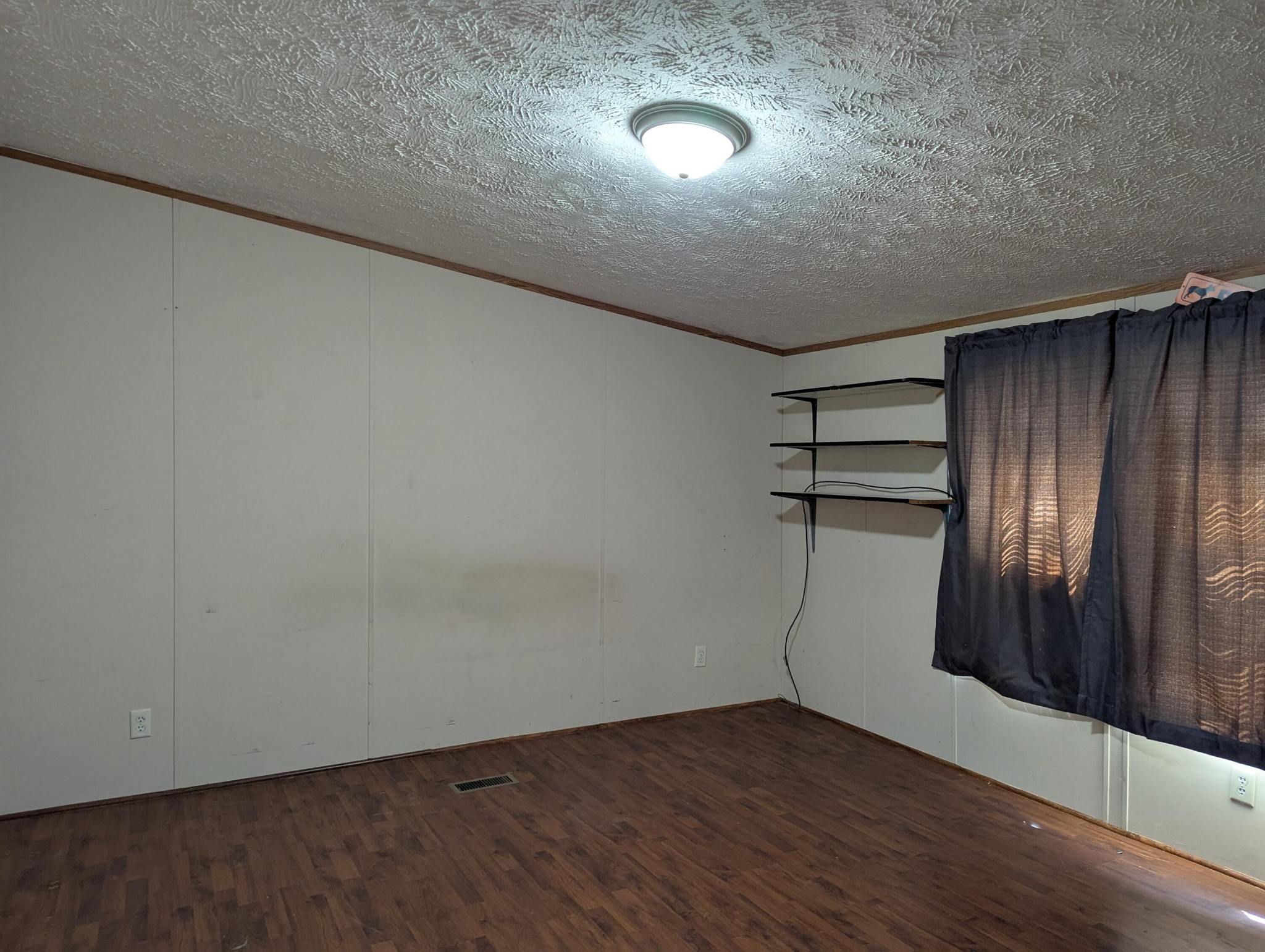 313 Burton Road Sweetwater, TN 37874 - Photo 13 of 38 an empty room with wooden floor and windows