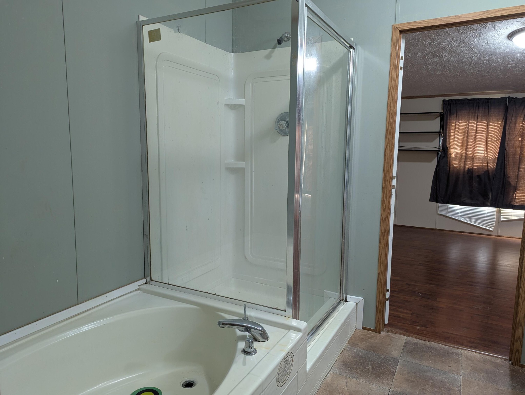 313 Burton Road Sweetwater, TN 37874 - Photo 18 of 38 a bathroom with a tub and shower