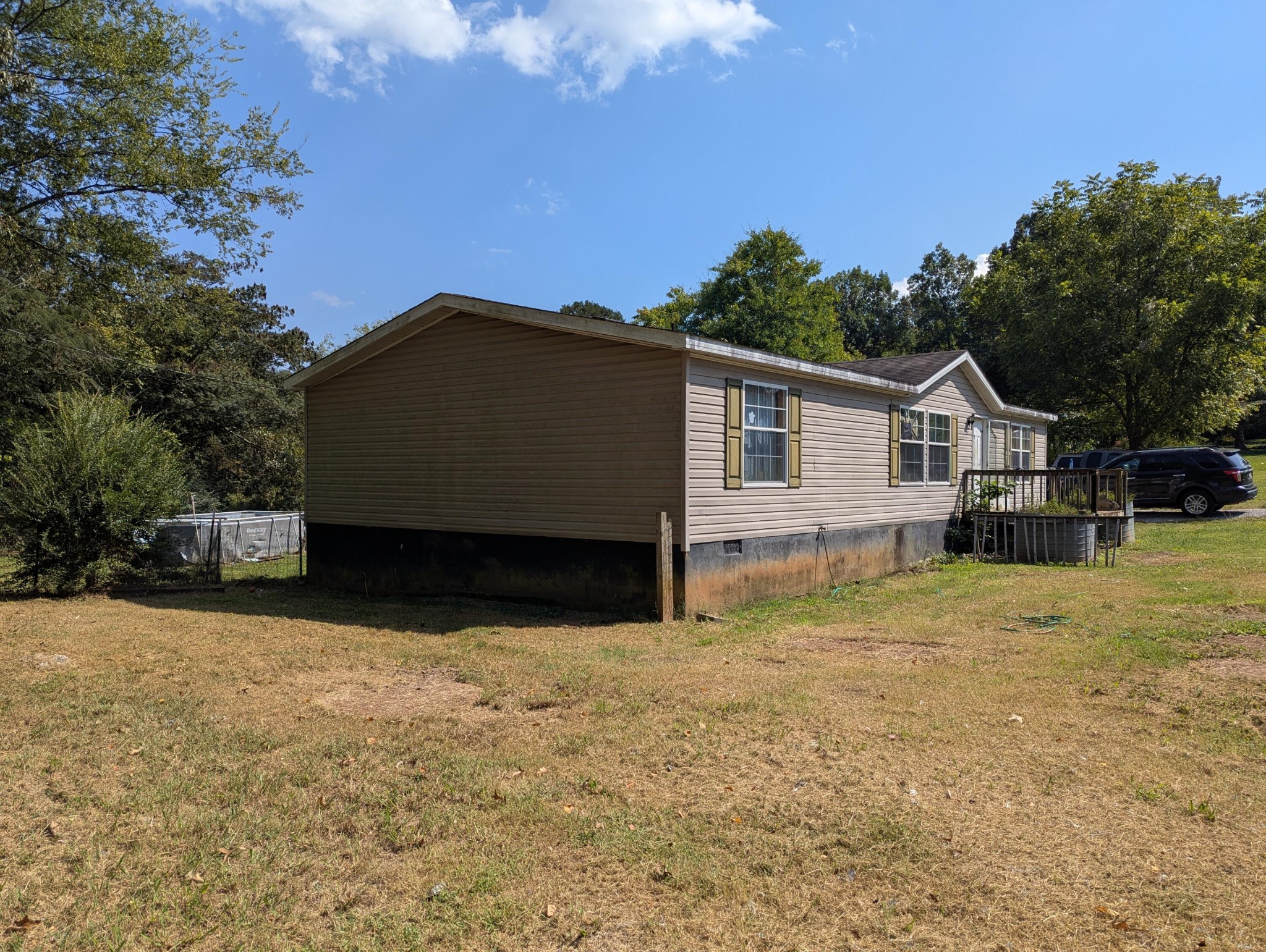 313 Burton Road Sweetwater, TN 37874 - Photo 27 of 38 a view of house with backyard and trees