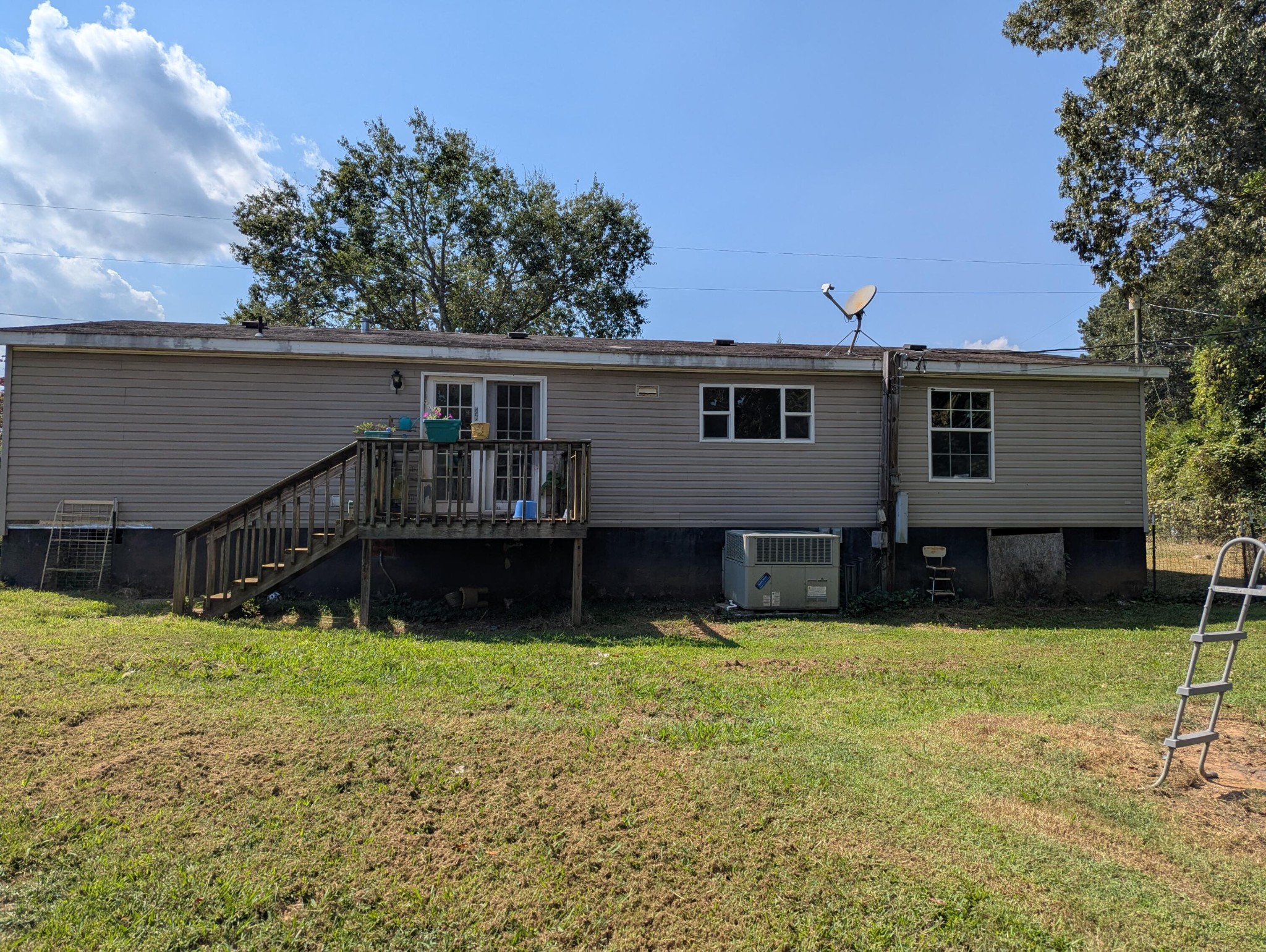 313 Burton Road Sweetwater, TN 37874 - Photo 29 of 38 a view of a house with swimming pool and sitting area in back