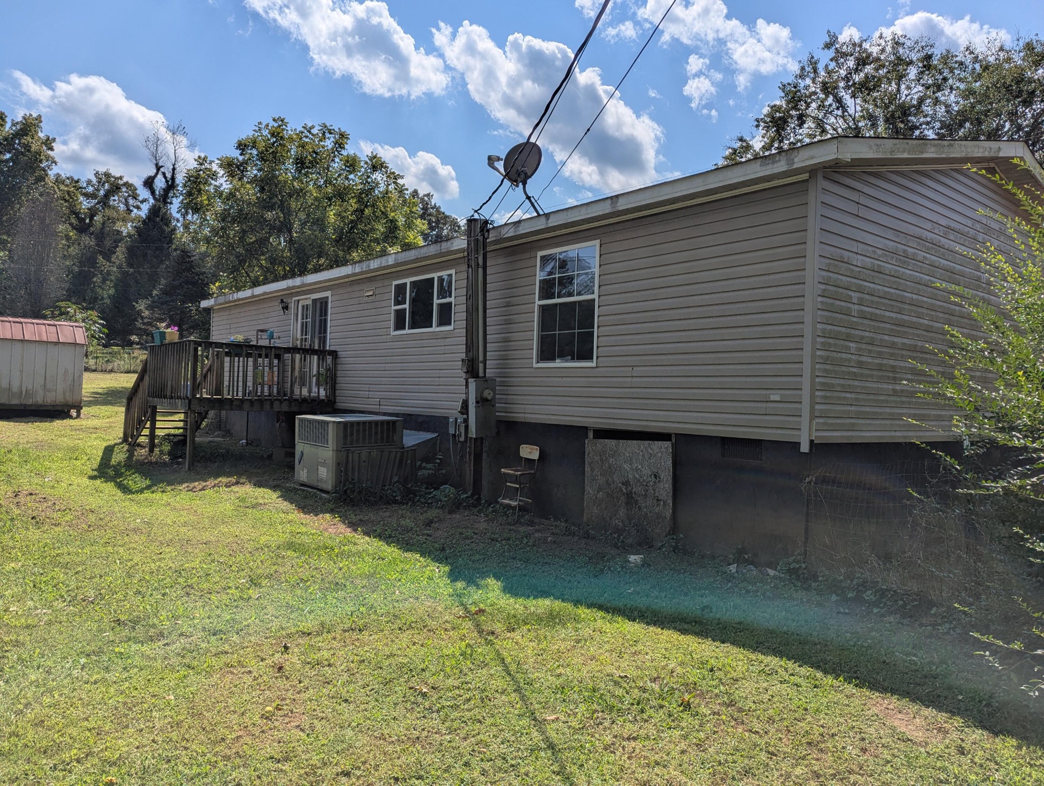 313 Burton Road Sweetwater, TN 37874 - Photo 30 of 38 a view of a backyard with a small cabin