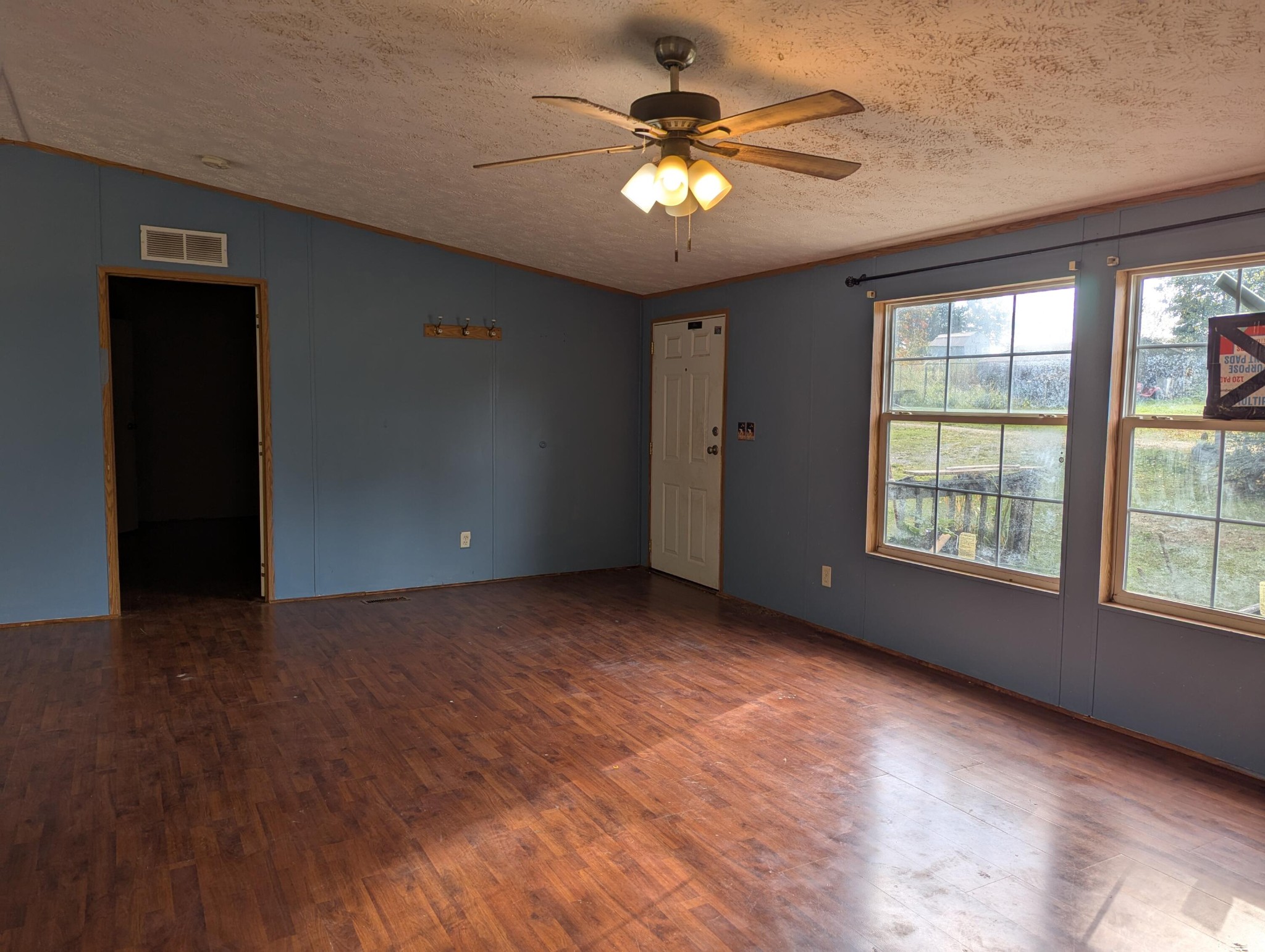 313 Burton Road Sweetwater, TN 37874 - Photo 5 of 38 a view of a livingroom with a ceiling fan and window