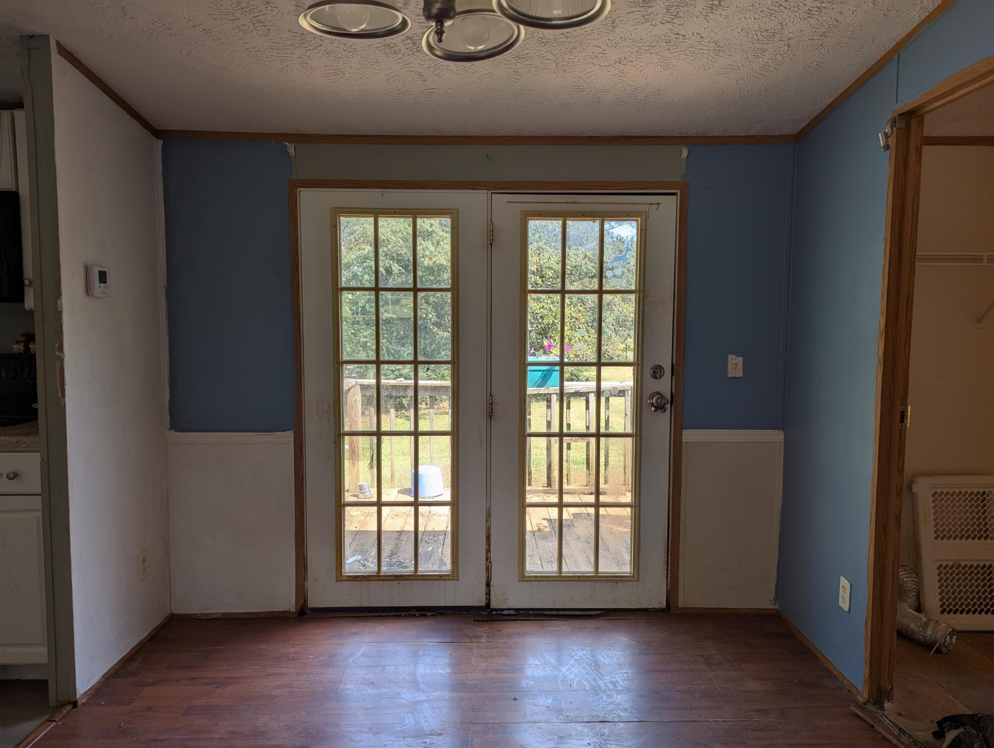 313 Burton Road Sweetwater, TN 37874 - Photo 7 of 38 a view of empty room with wooden floor and fan
