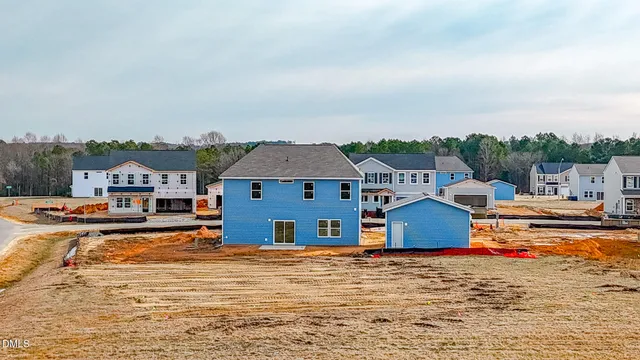 a view of multiple houses with outdoor space