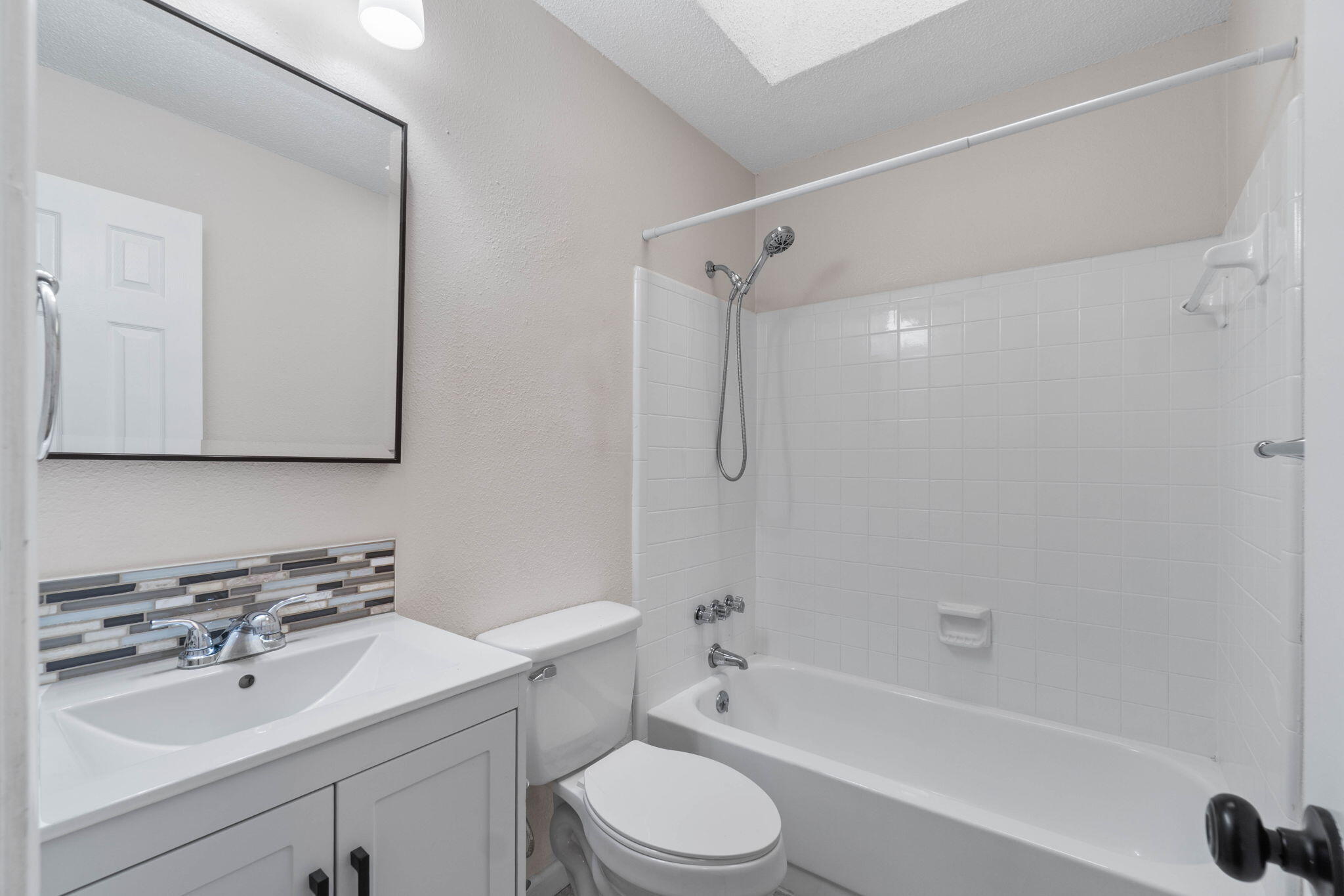 634 Lloyd Street Fort Walton Beach, FL 32547 - Photo 18 of 27 a bathroom with a sink toilet and shower