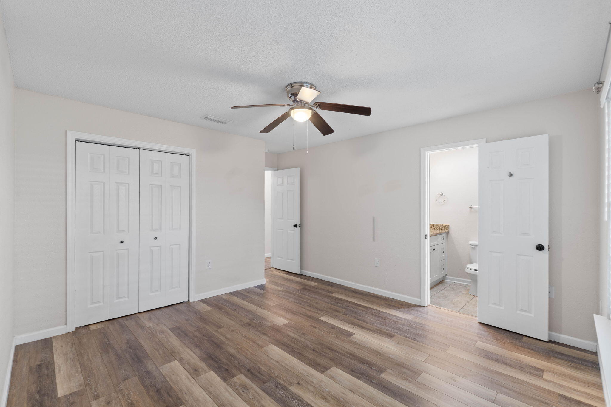 634 Lloyd Street Fort Walton Beach, FL 32547 - Photo 20 of 27 a view of room with hardwood ceiling fan and window