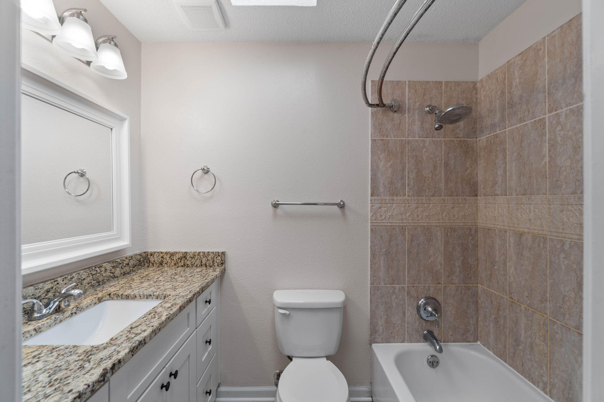 634 Lloyd Street Fort Walton Beach, FL 32547 - Photo 22 of 27 a bathroom with a granite countertop sink toilet and shower