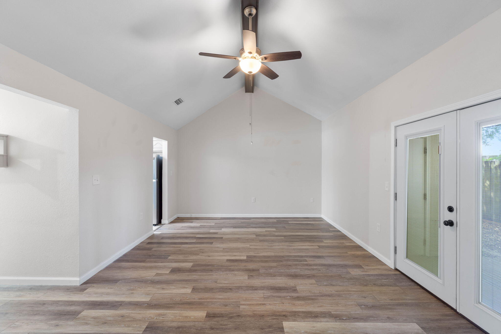 634 Lloyd Street Fort Walton Beach, FL 32547 - Photo 7 of 27 a view of an empty room with wooden floor