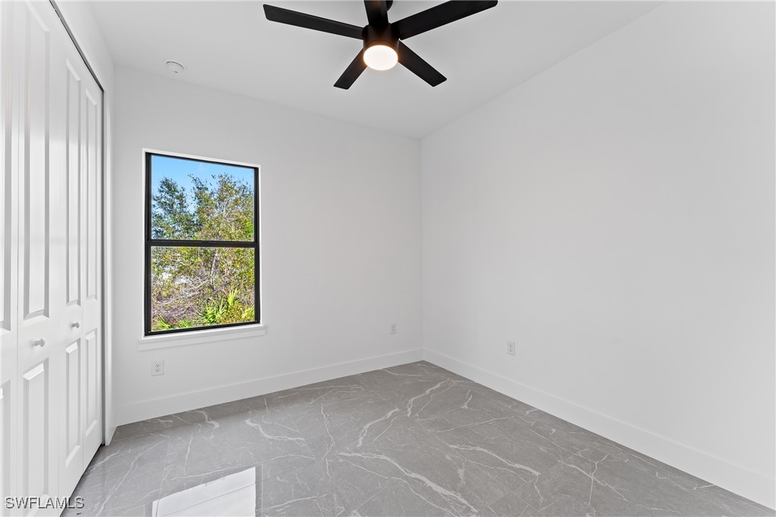 1024 Chauncey Avenue Lehigh Acres, FL 33971 - Photo 19 of 39 an empty room with a window
