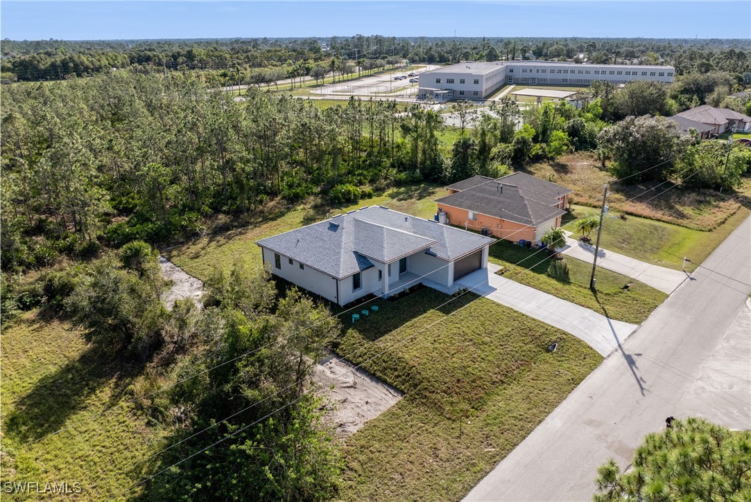 1024 Chauncey Avenue Lehigh Acres, FL 33971 - Photo 35 of 39 an aerial view of a house with balcony