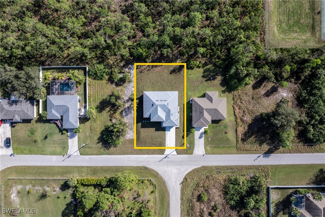 1024 Chauncey Avenue Lehigh Acres, FL 33971 - Photo 37 of 39 an aerial view of a house with swimming pool