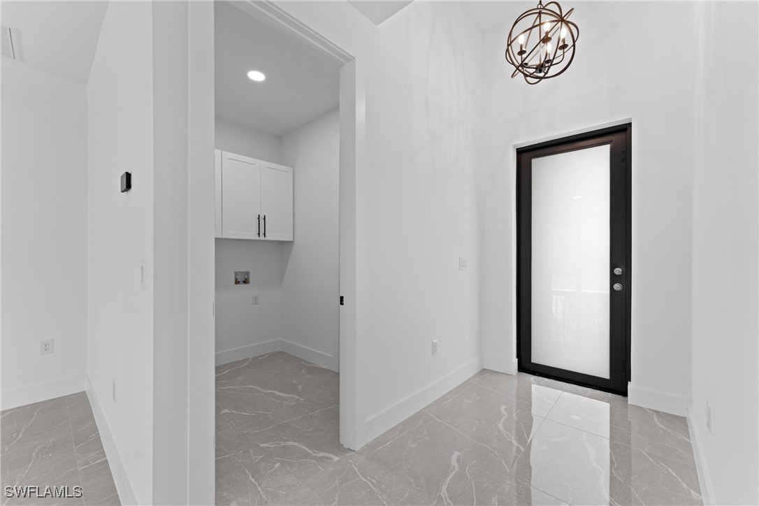 1024 Chauncey Avenue Lehigh Acres, FL 33971 - Photo 9 of 39 a view of a hallway with elevator