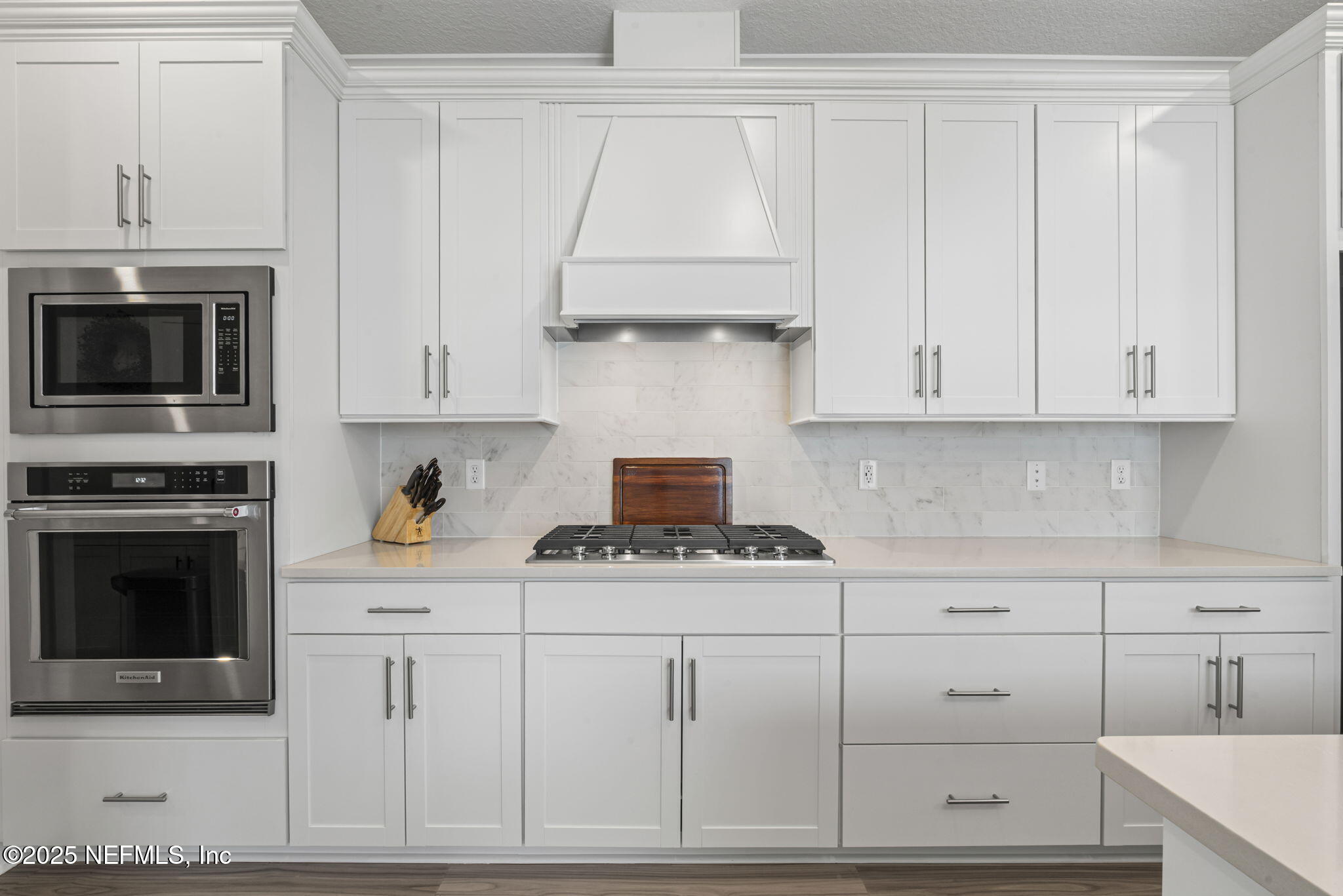 217 Fairlake Cir Street St. Augustine, FL 32092 - Photo 12 of 47 a kitchen with white cabinets and appliances