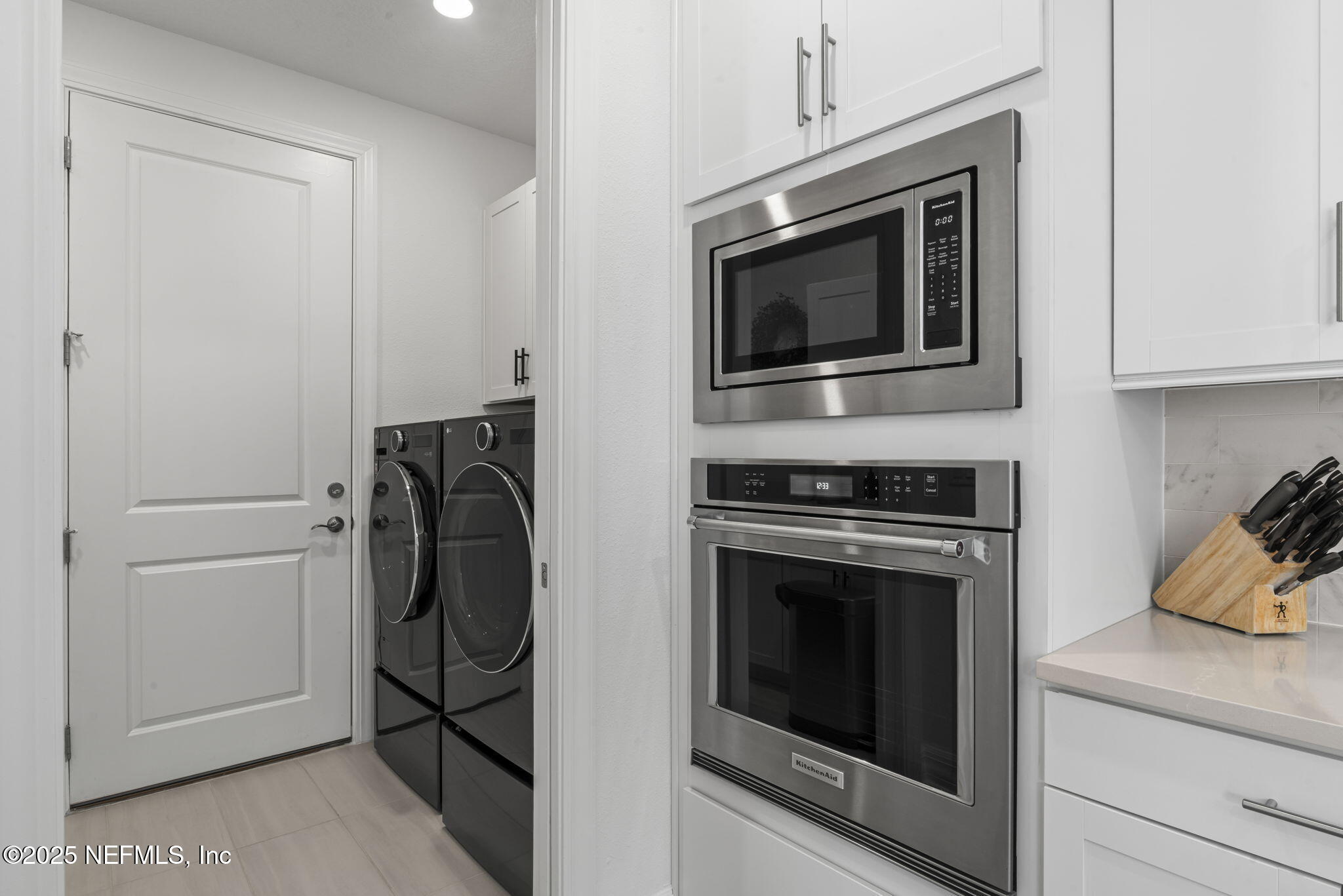217 Fairlake Cir Street St. Augustine, FL 32092 - Photo 13 of 47 a kitchen with a stove and a microwave