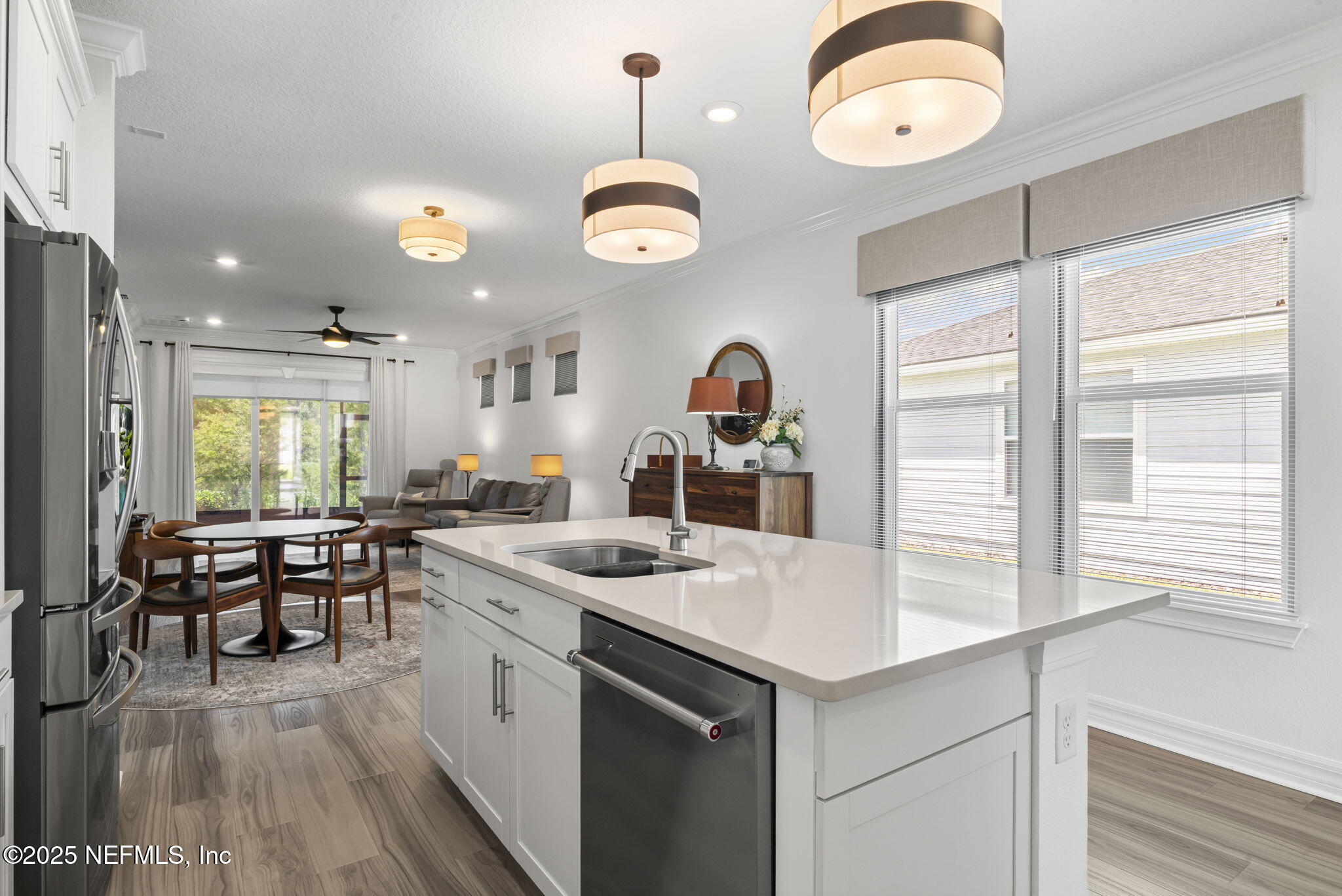 217 Fairlake Cir Street St. Augustine, FL 32092 - Photo 16 of 47 a kitchen with a table chairs stove and cabinets