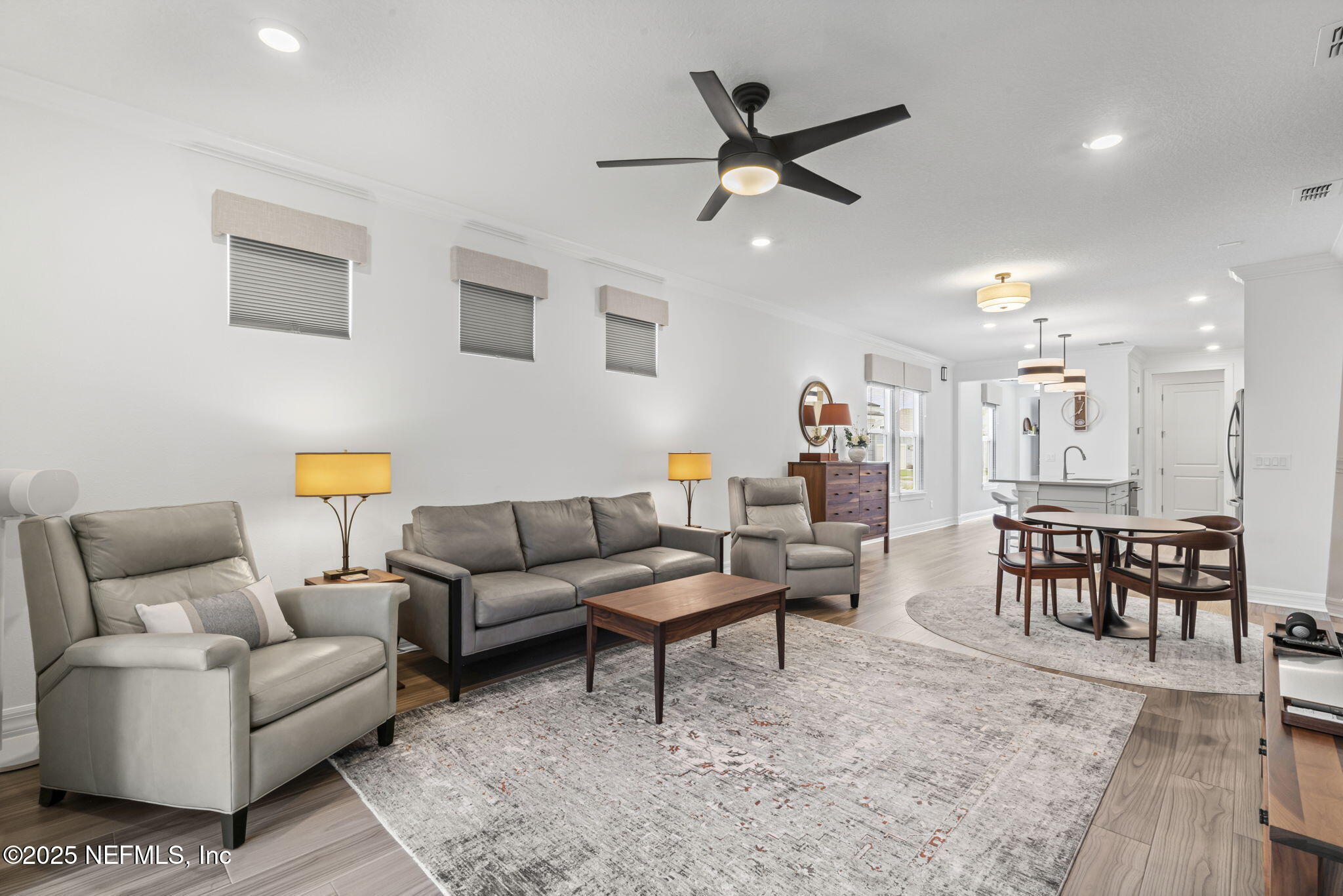 217 Fairlake Cir Street St. Augustine, FL 32092 - Photo 19 of 47 a living room with furniture kitchen view and a wooden floor