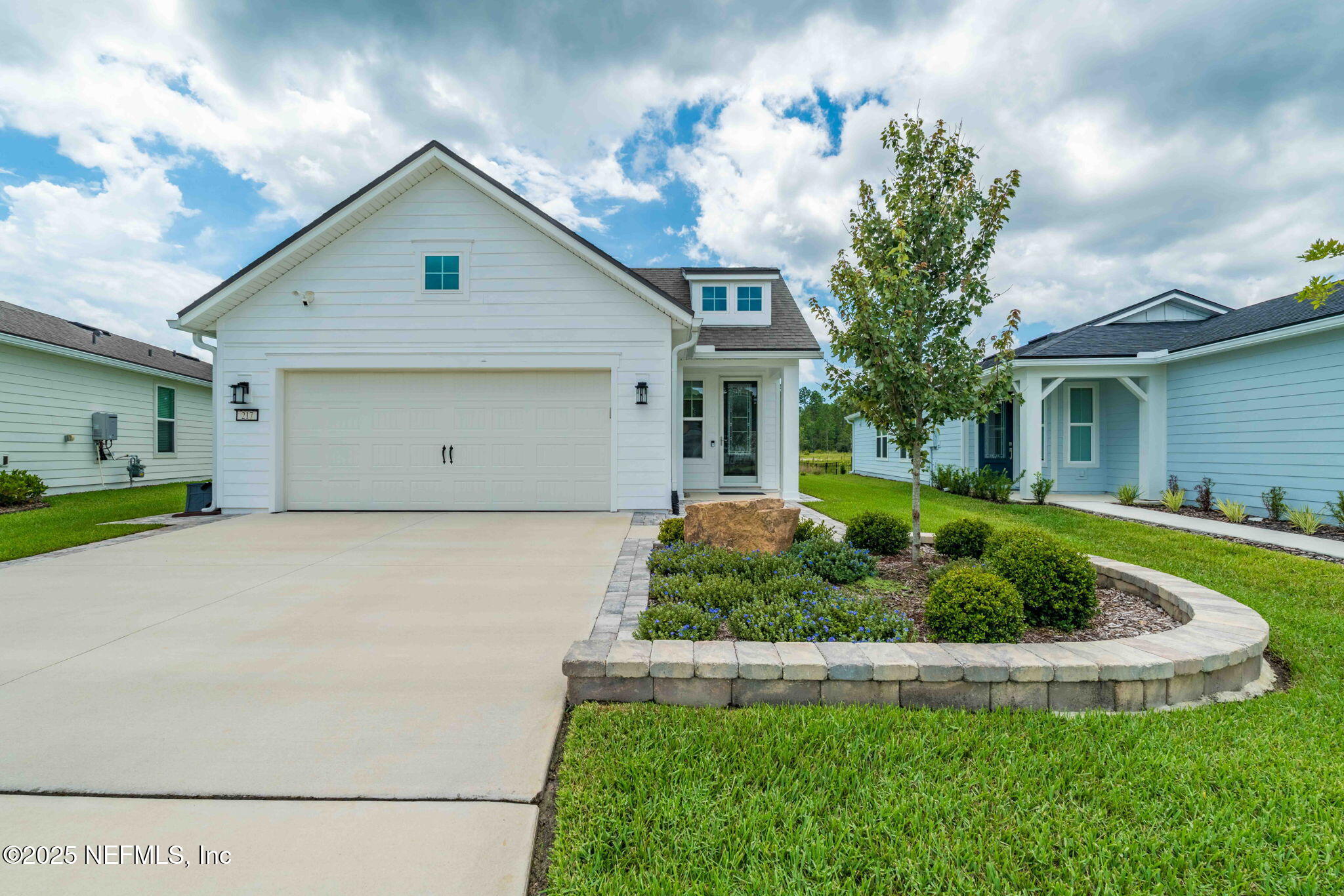 217 Fairlake Cir Street St. Augustine, FL 32092 - Photo 2 of 47 a front view of a house with a yard