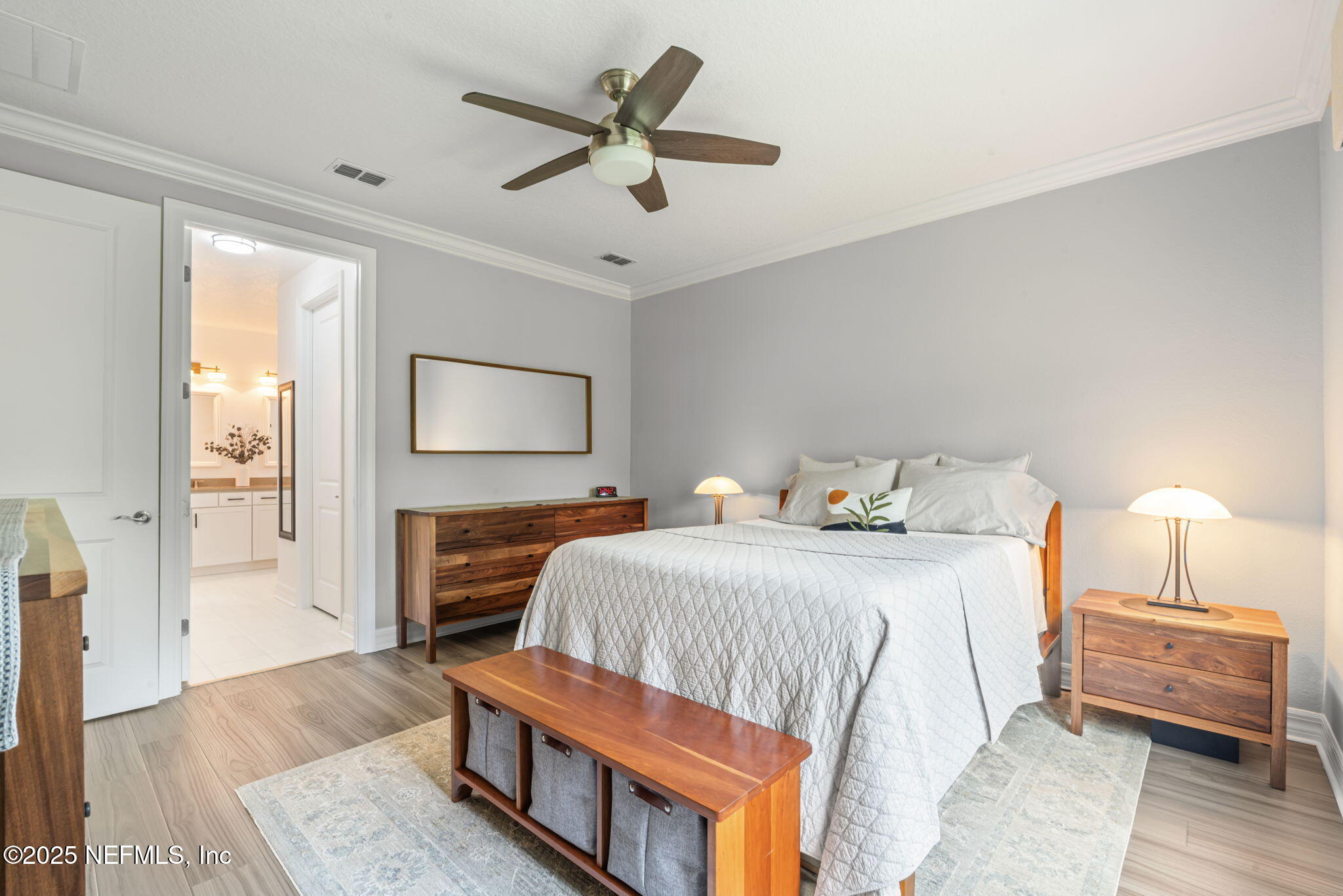 217 Fairlake Cir Street St. Augustine, FL 32092 - Photo 23 of 47 a bedroom with a bed and a chandelier