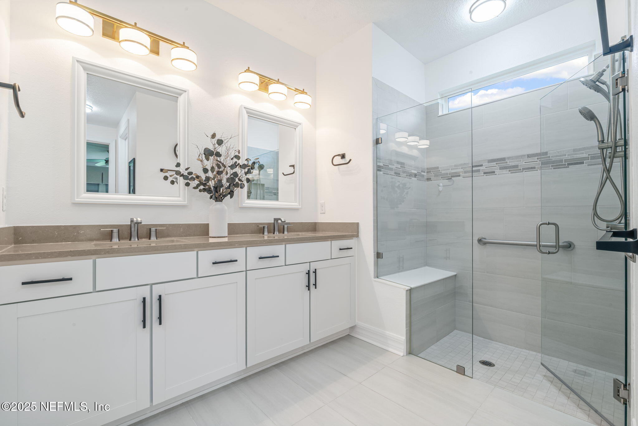 217 Fairlake Cir Street St. Augustine, FL 32092 - Photo 26 of 47 a bathroom with a shower sink and mirror