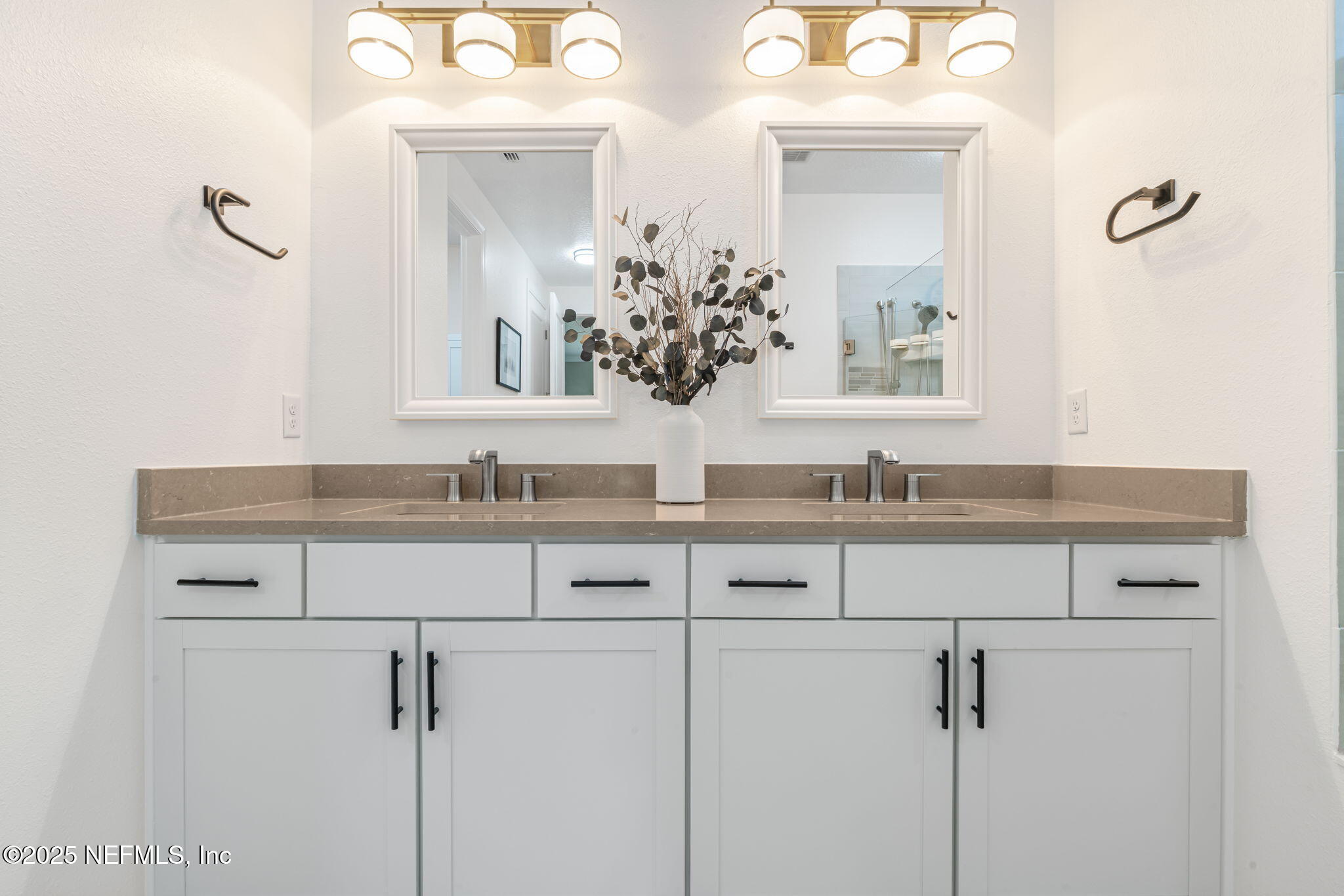 217 Fairlake Cir Street St. Augustine, FL 32092 - Photo 27 of 47 a bathroom with double sink and a mirror