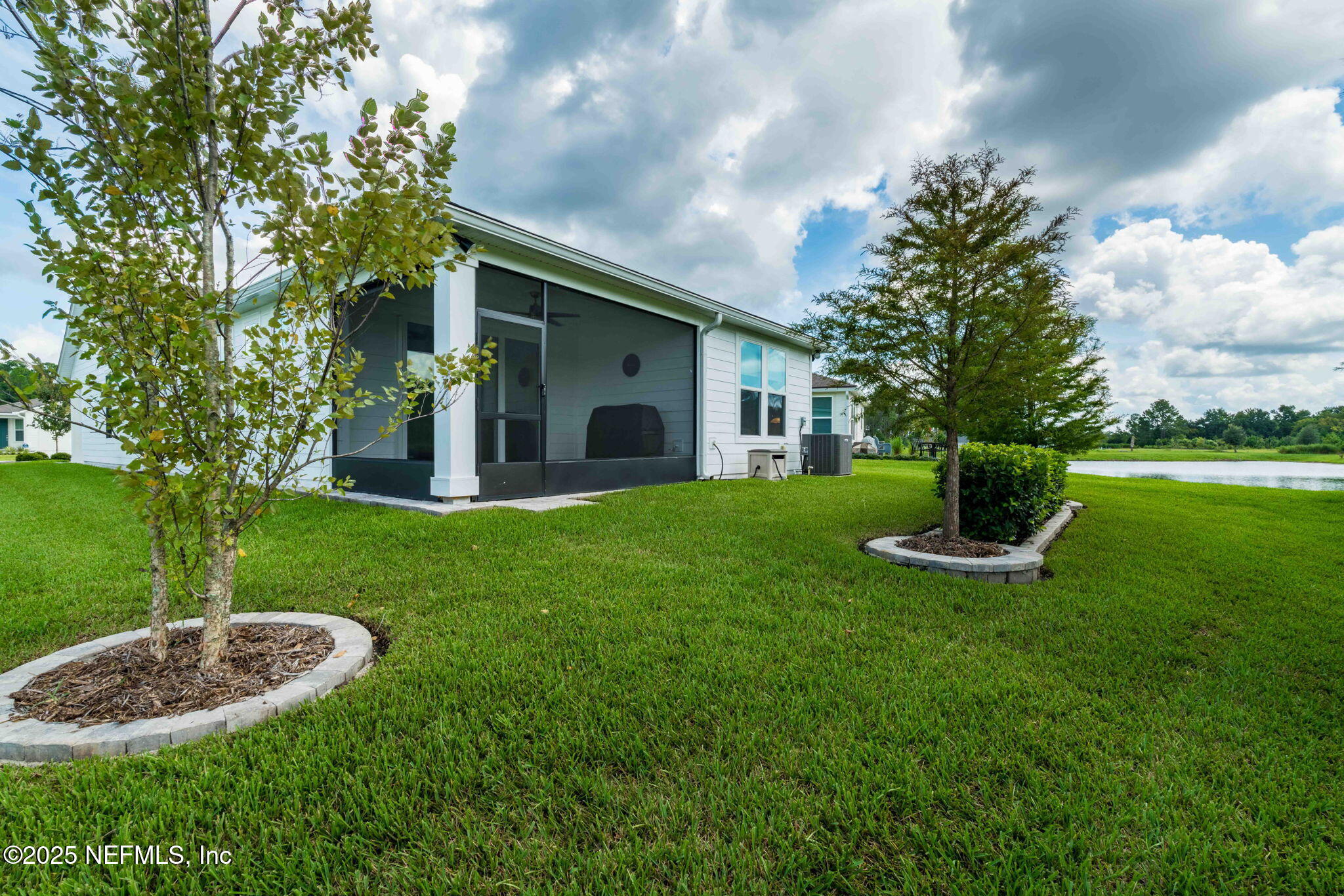 217 Fairlake Cir Street St. Augustine, FL 32092 - Photo 38 of 47 a view of a house with a yard patio and a garden