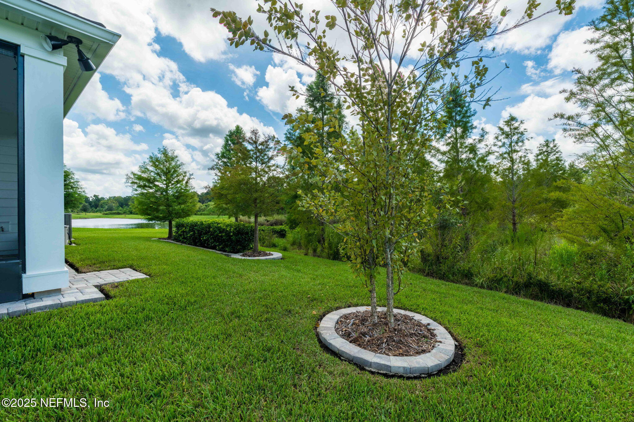 217 Fairlake Cir Street St. Augustine, FL 32092 - Photo 39 of 47 a view of a table and chairs in the garden