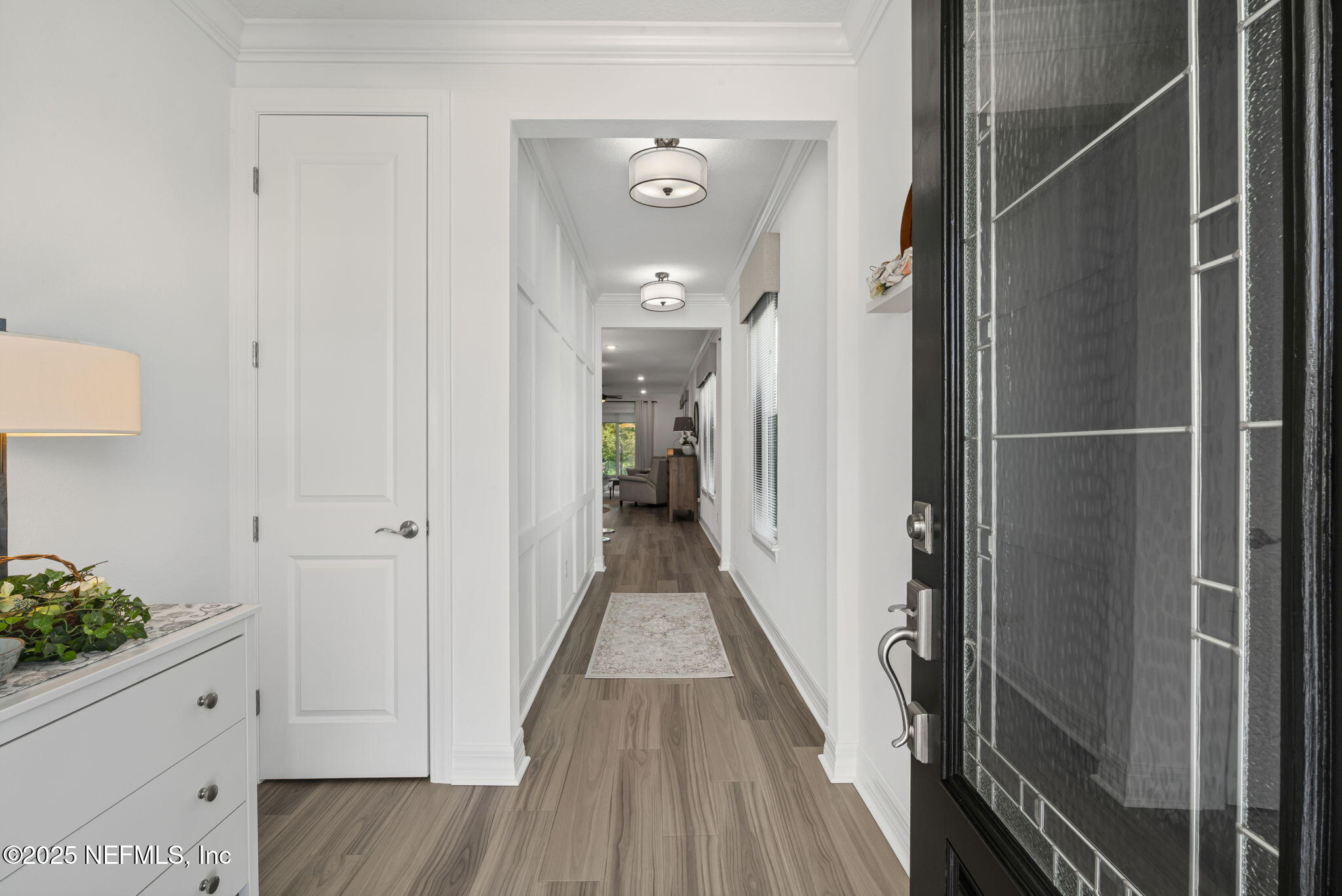 217 Fairlake Cir Street St. Augustine, FL 32092 - Photo 6 of 47 a view of a hallway with wooden floor and staircase