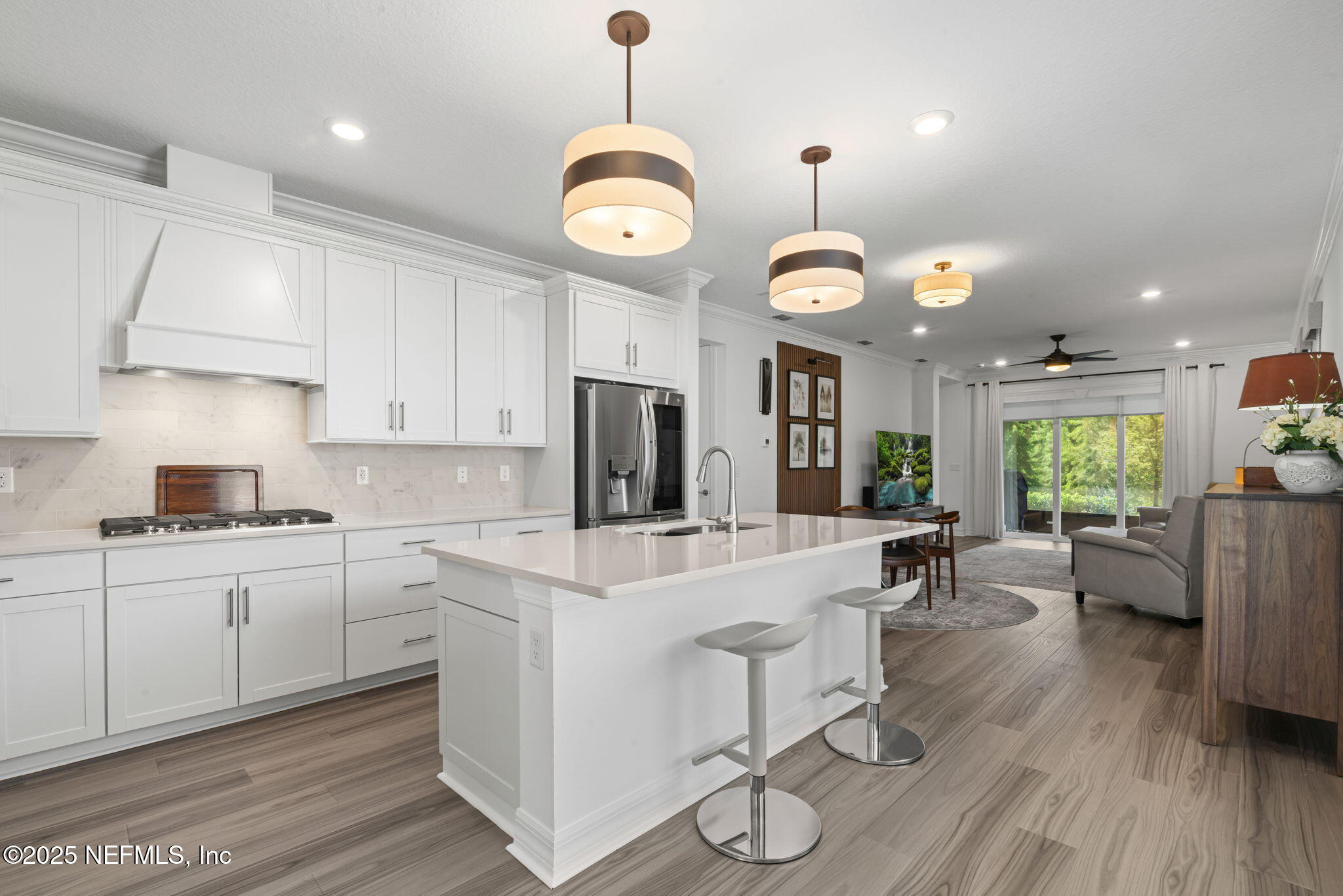 217 Fairlake Cir Street St. Augustine, FL 32092 - Photo 9 of 47 a large white kitchen with lots of counter space a sink appliances and dining table