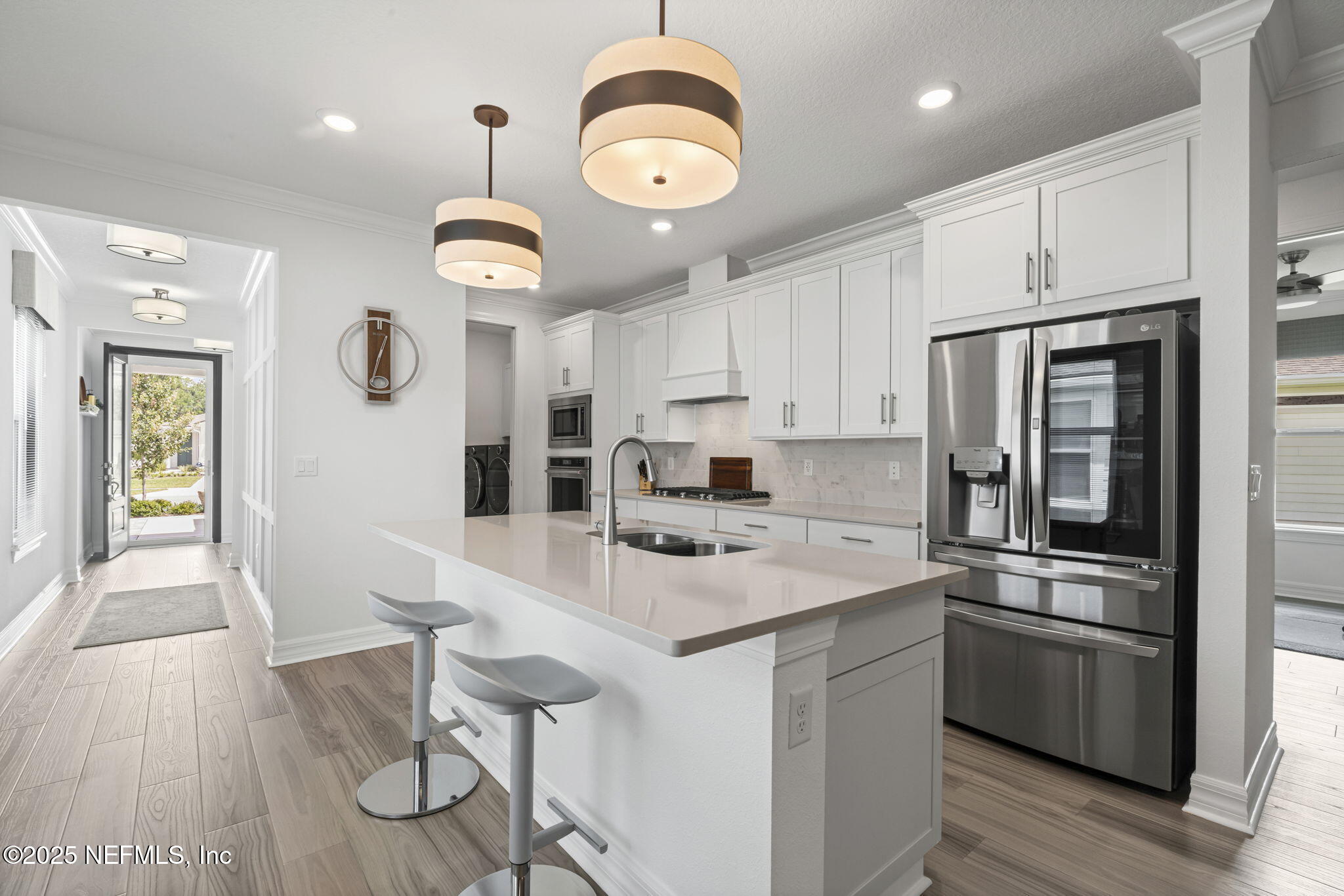 217 Fairlake Cir Street St. Augustine, FL 32092 - Photo 10 of 47 a kitchen with a center island stainless steel appliances and wooden floor