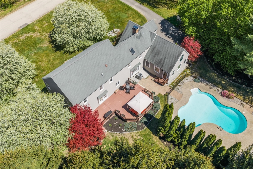 4 Ridge Road Pepperell, MA 01463 - Photo 3 of 42 an aerial view of a house with a garden and swimming pool
