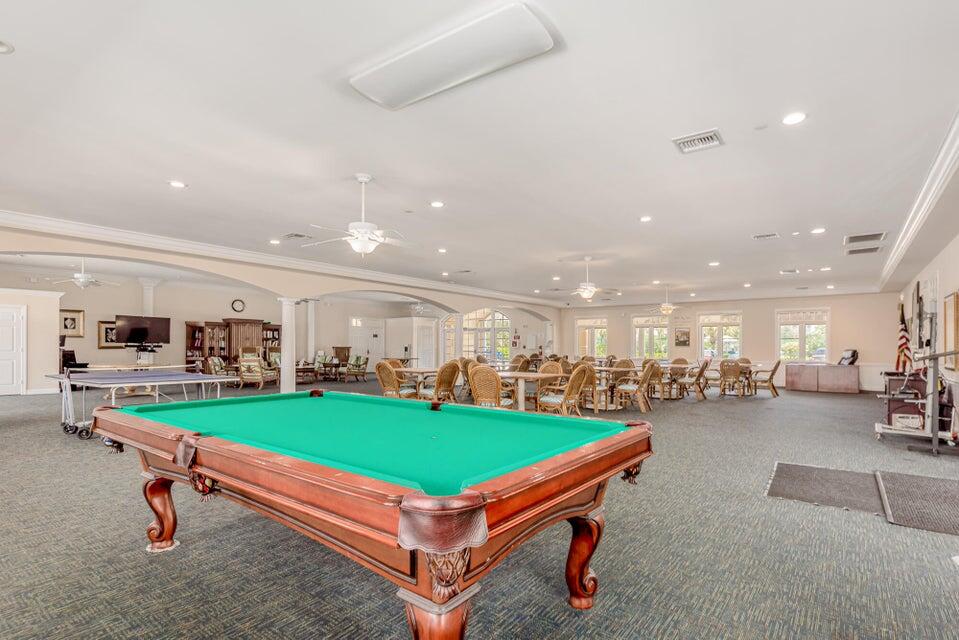 17 Harbour Isle Drive West, Unit 103 Fort Pierce, FL 34949 - Photo 15 of 17 a room with pool table and couches chair and tables