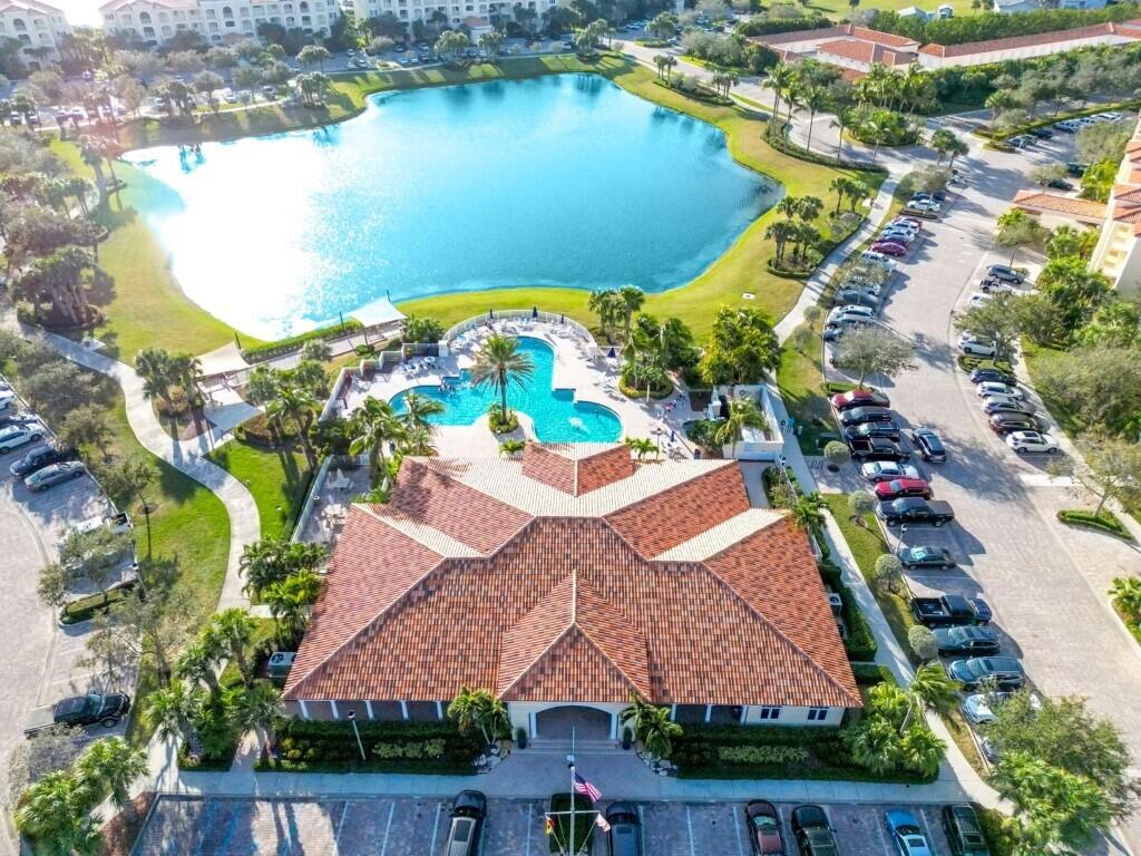 17 Harbour Isle Drive West, Unit 103 Fort Pierce, FL 34949 - Photo 16 of 17 an aerial view of residential houses with outdoor space and lake view