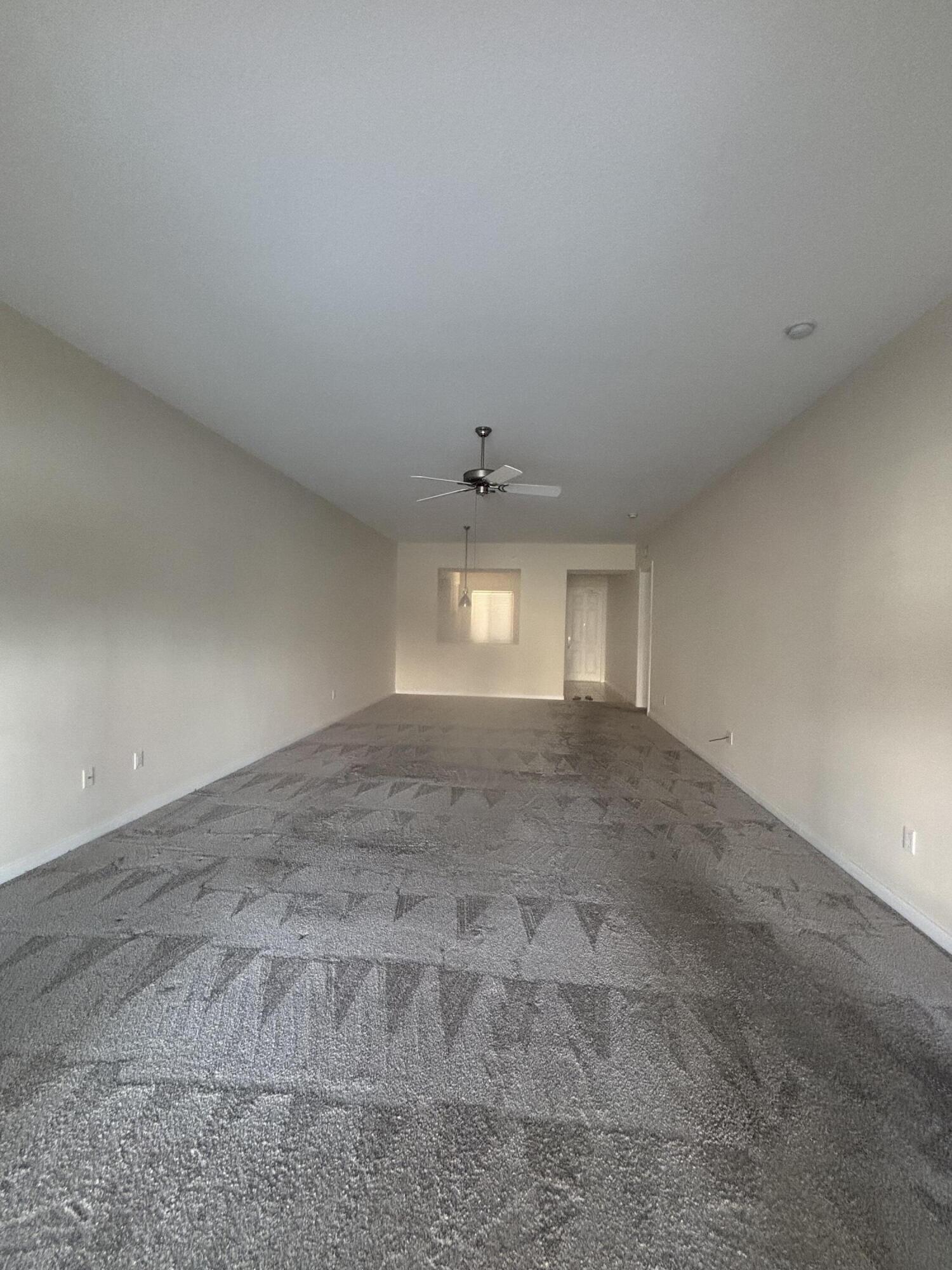 17 Harbour Isle Drive West, Unit 103 Fort Pierce, FL 34949 - Photo 4 of 17 wooden floor in an empty room