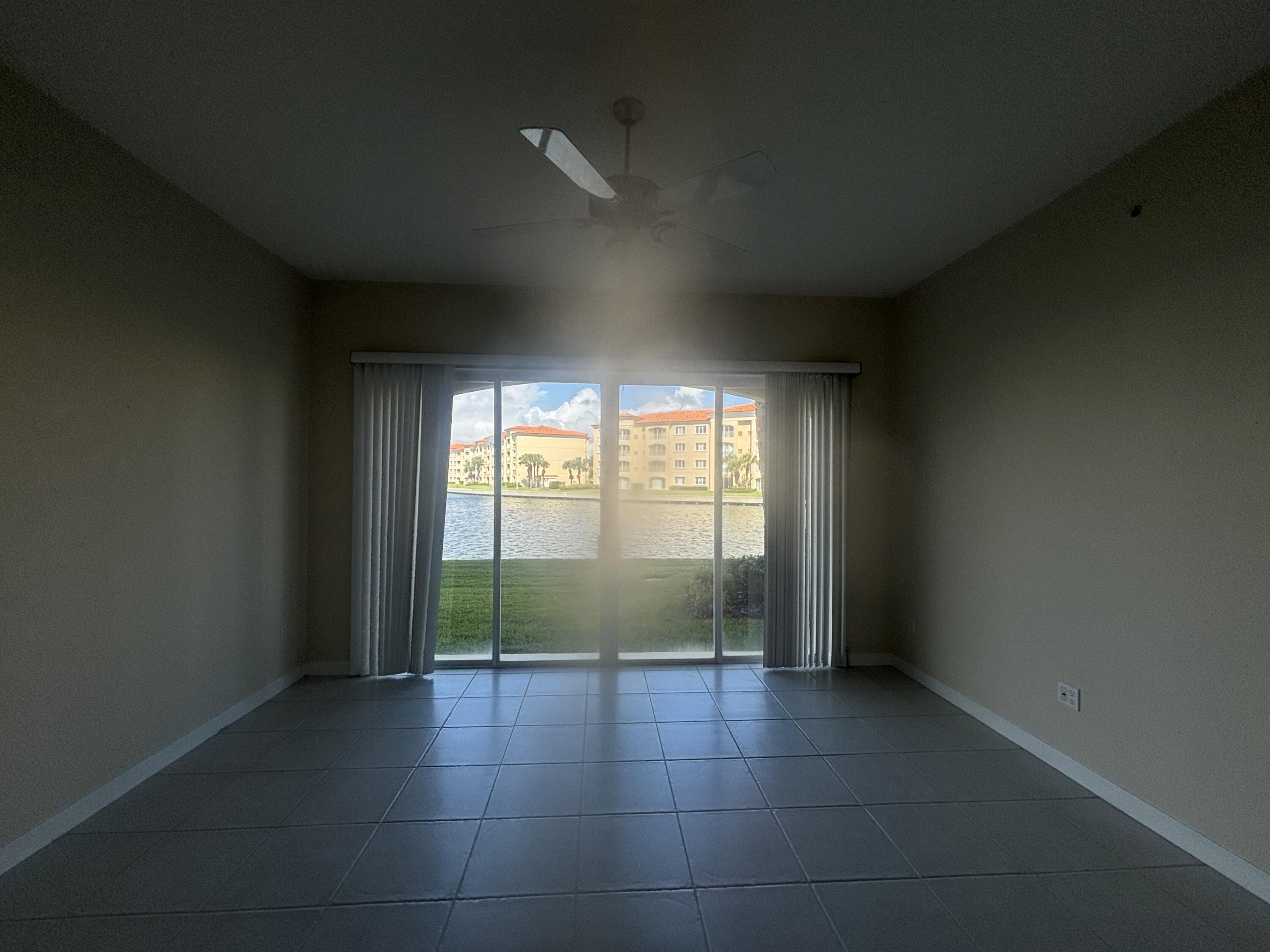17 Harbour Isle Drive West, Unit 103 Fort Pierce, FL 34949 - Photo 6 of 17 an empty room with large windows