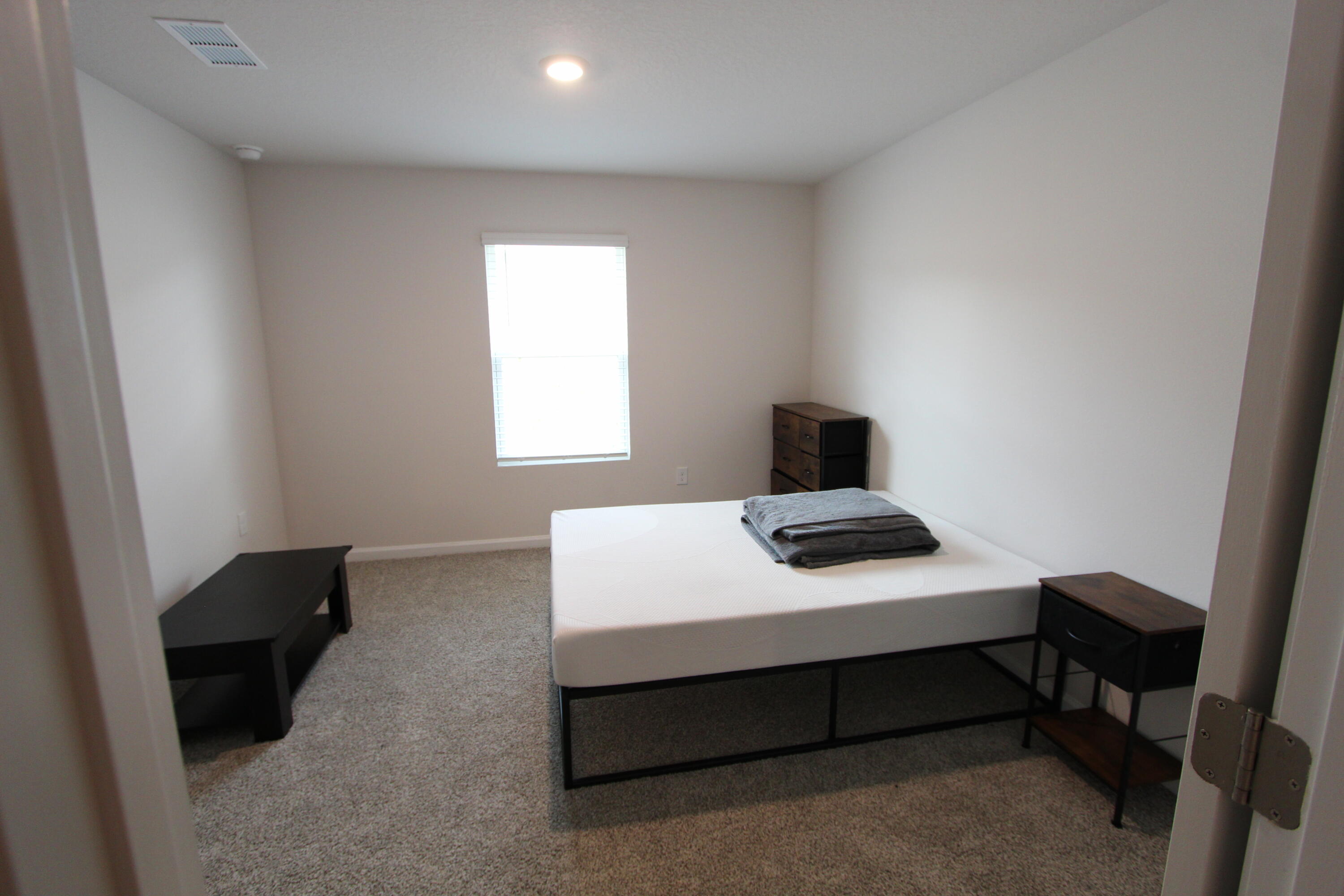 3063 Jane Lane Crestview, FL 32539 - Photo 12 of 30 a bedroom with a bed and a window