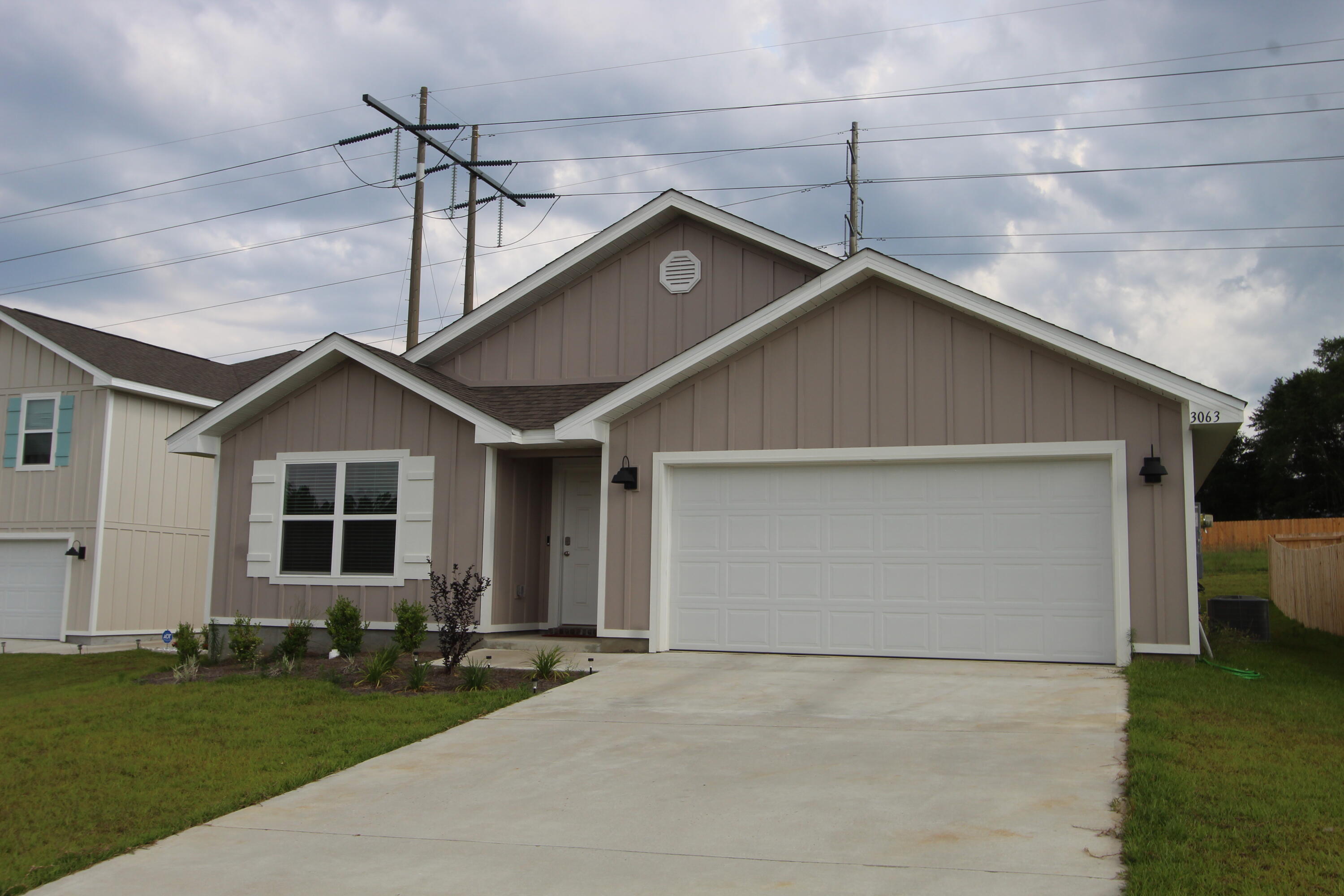 3063 Jane Lane Crestview, FL 32539 - Photo 2 of 30 a house with yard in front of it