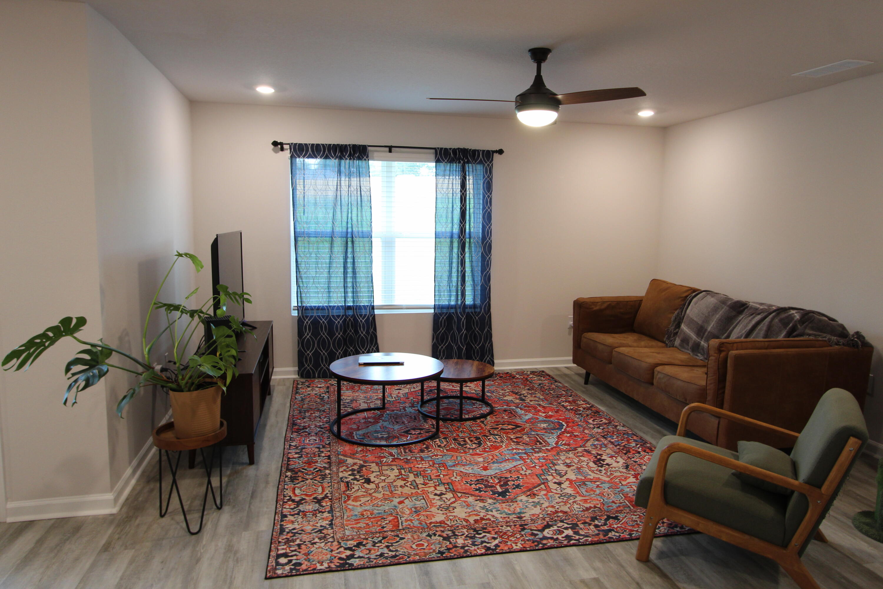 3063 Jane Lane Crestview, FL 32539 - Photo 21 of 30 a living room with furniture and a potted plant