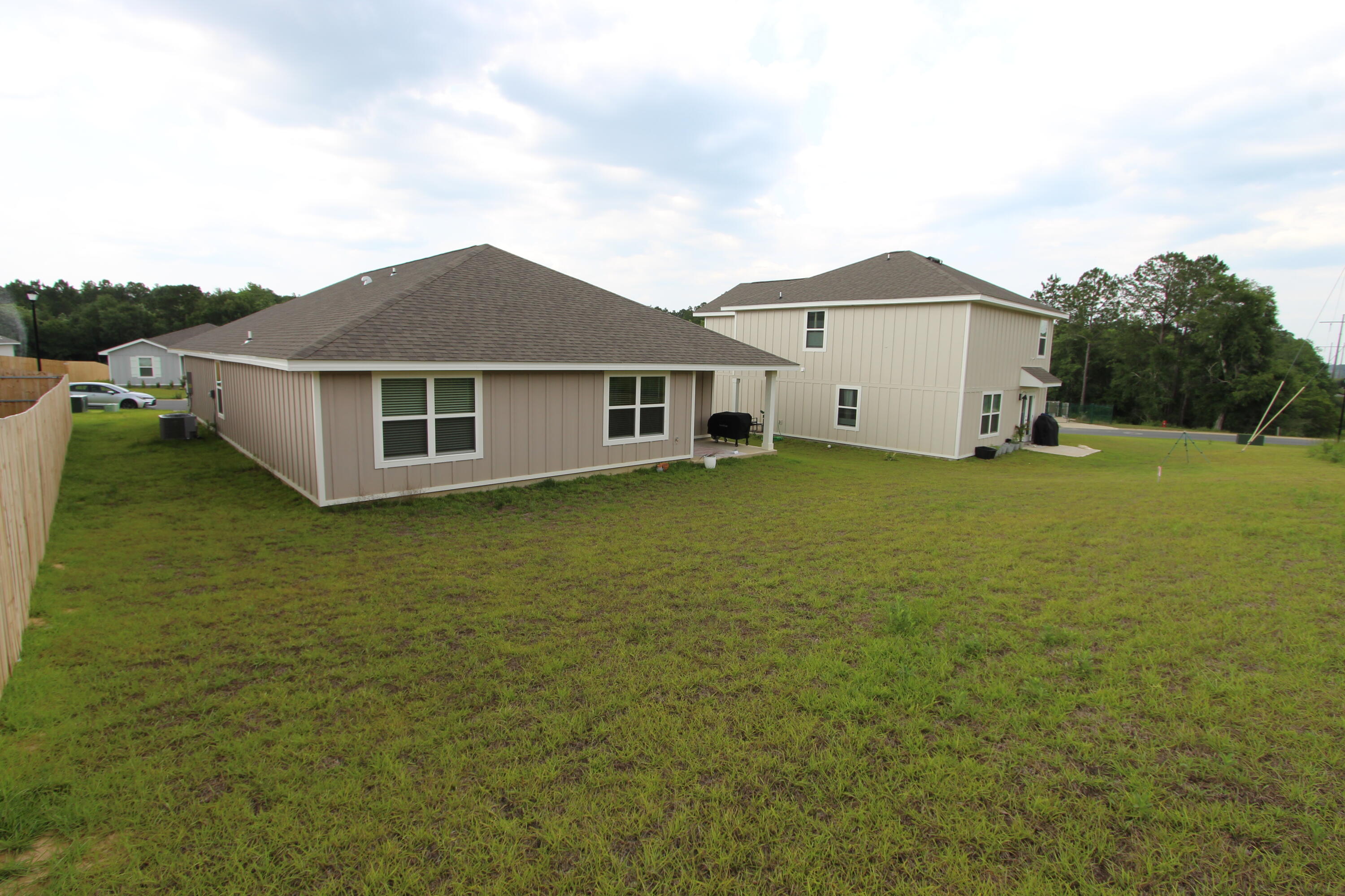 3063 Jane Lane Crestview, FL 32539 - Photo 30 of 30 a big house with a big yard and large trees