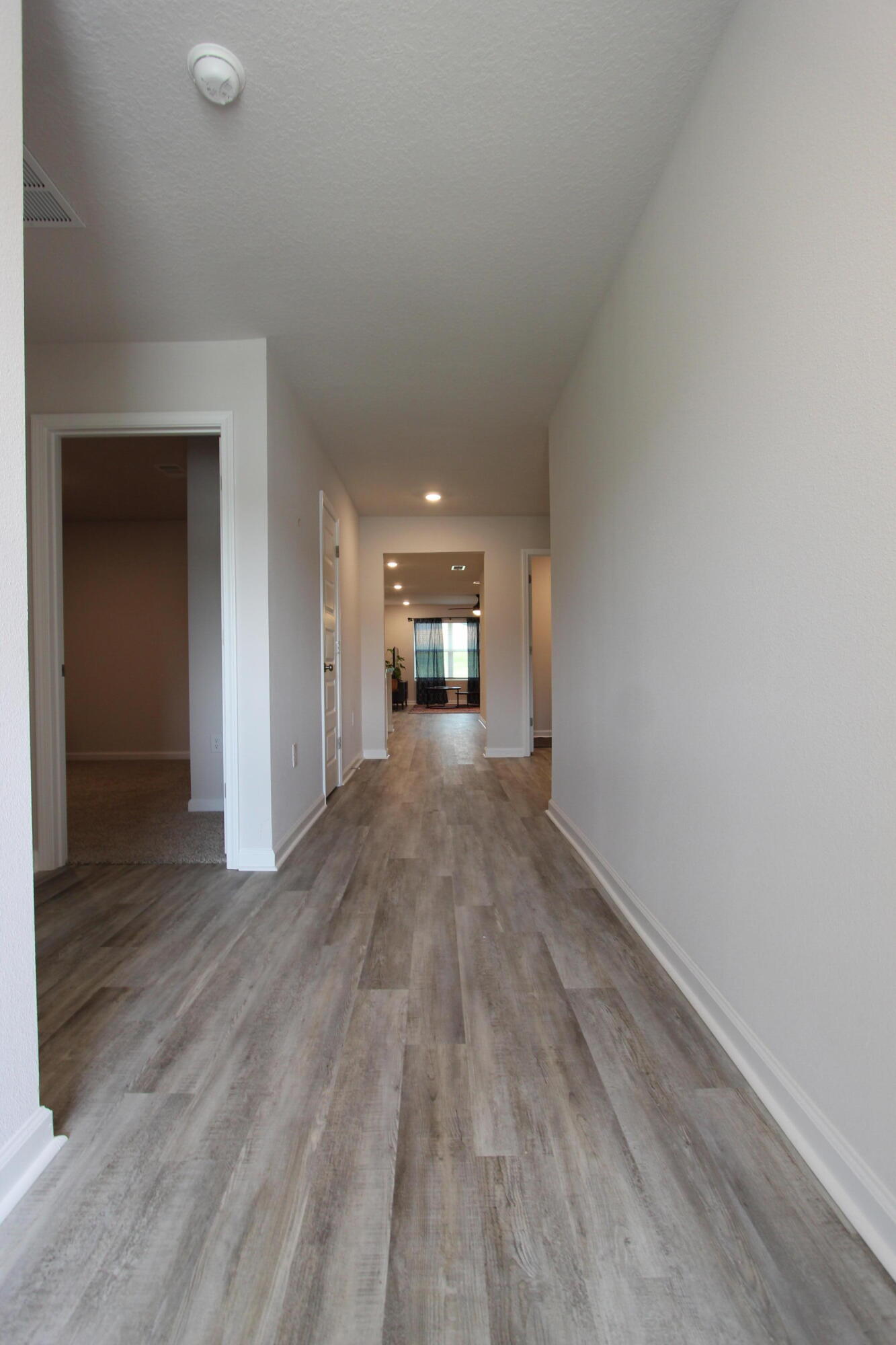 3063 Jane Lane Crestview, FL 32539 - Photo 5 of 30 a view of empty room with wooden floor