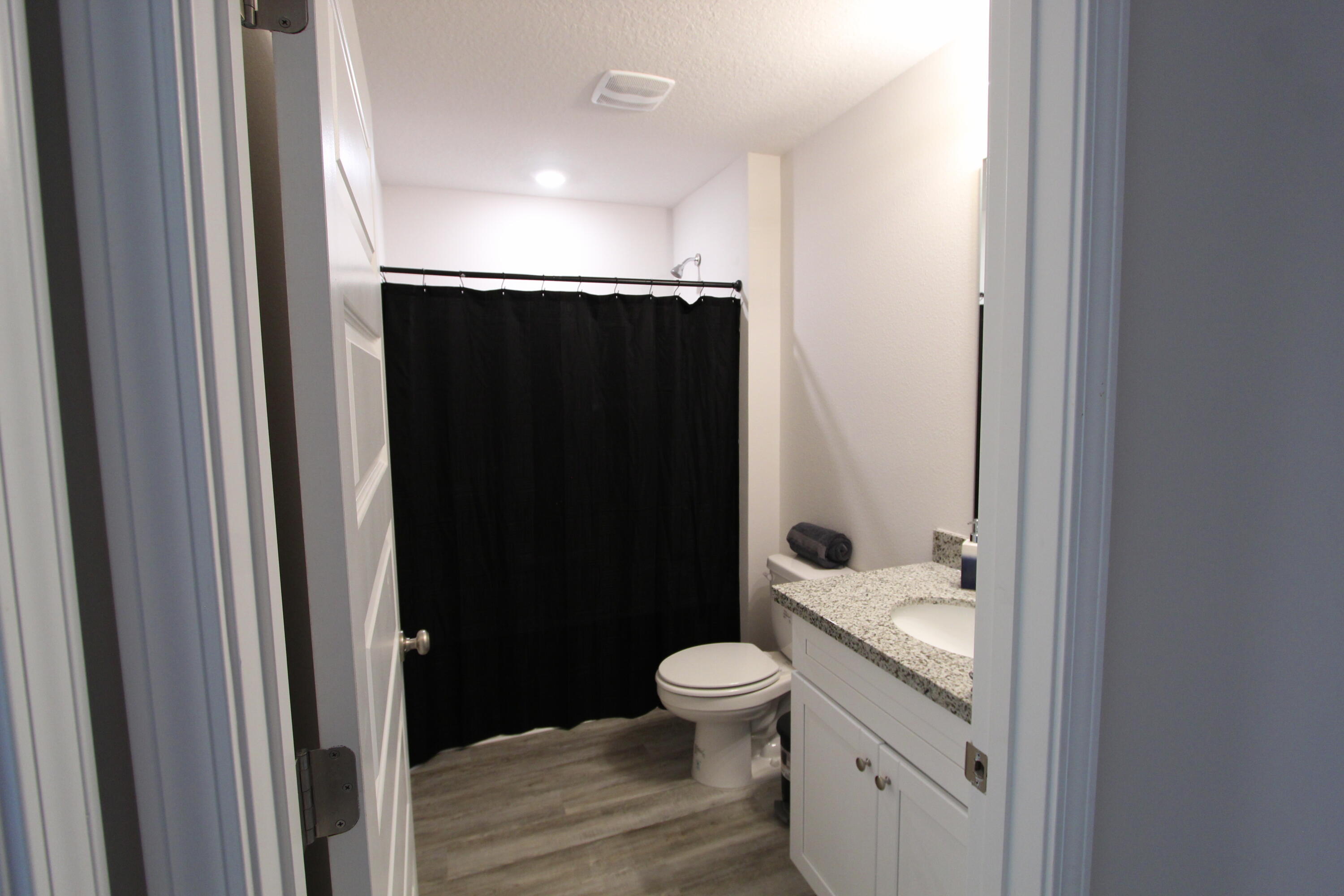 3063 Jane Lane Crestview, FL 32539 - Photo 9 of 30 a bathroom with a sink toilet and shower