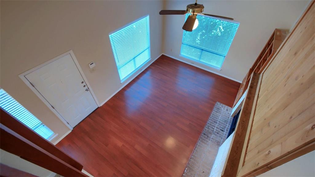908 Poplar Street, Unit 203 Austin, TX 78705 - Photo 3 of 9 a view of a hallway with wooden floor and stairs