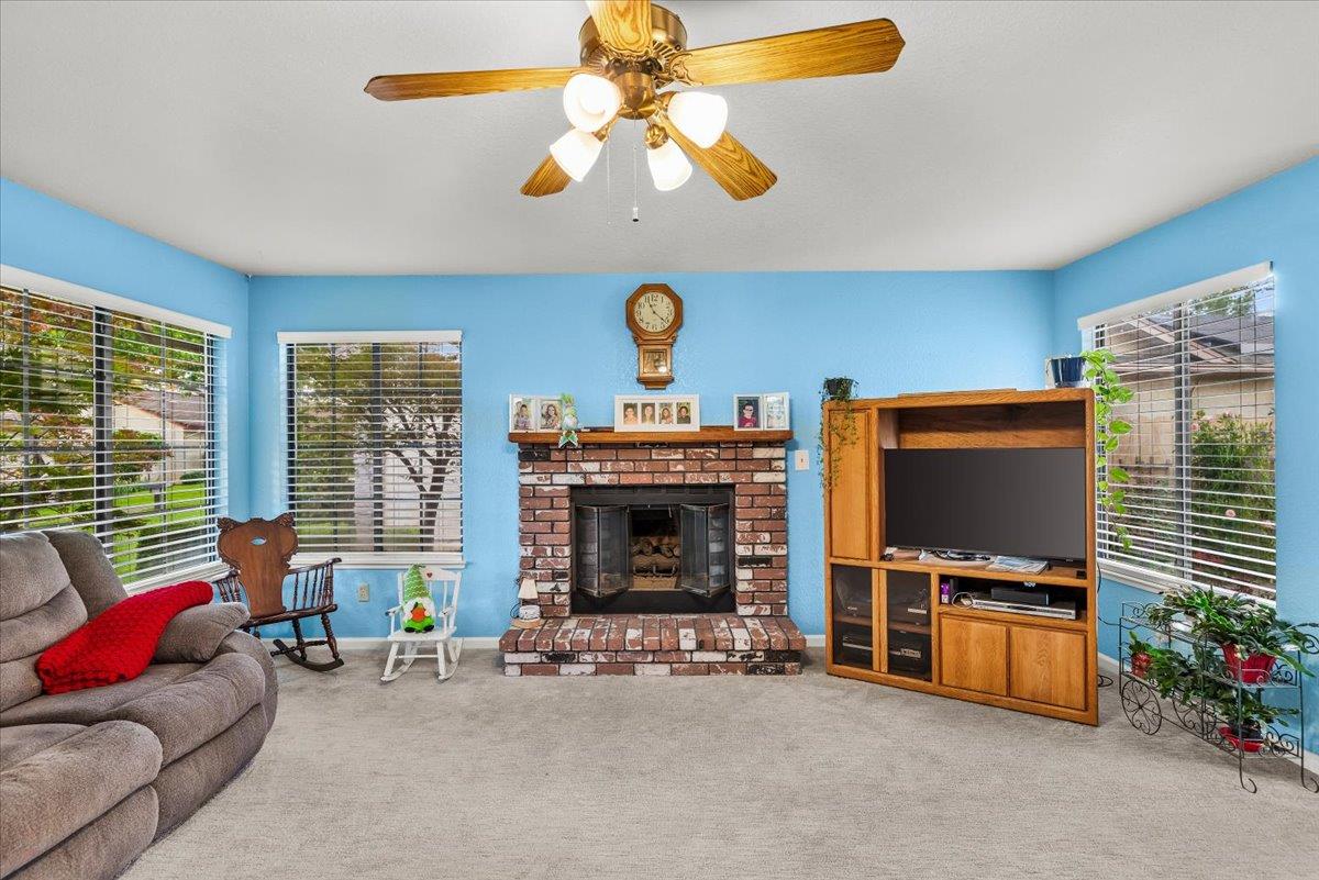 2136 Candy Cane Walk Manteca, CA 95336 - Photo 11 of 60 a living room with furniture and a fireplace
