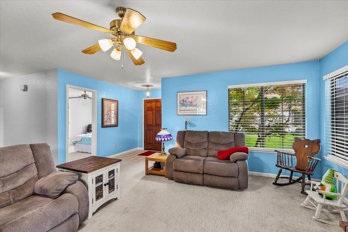 2136 Candy Cane Walk Manteca, CA 95336 - Photo 12 of 60 a living room with furniture and a large window