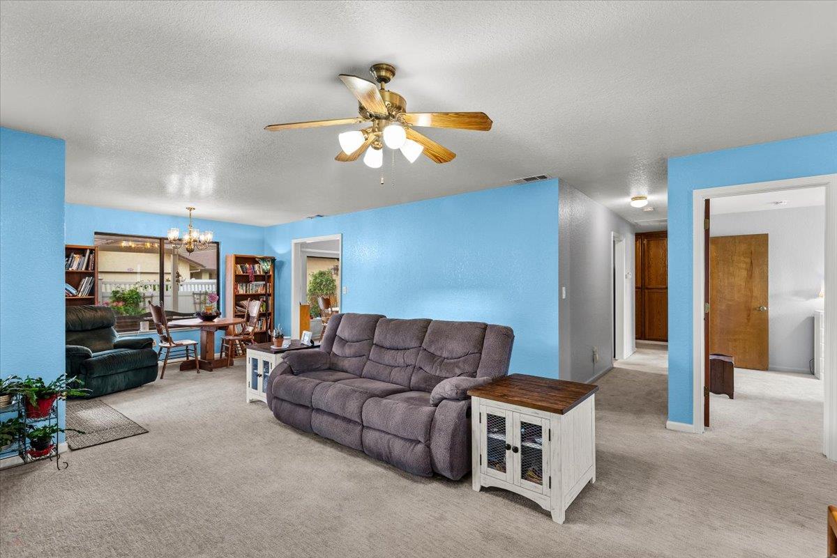 2136 Candy Cane Walk Manteca, CA 95336 - Photo 13 of 60 a living room with furniture and a flat screen tv